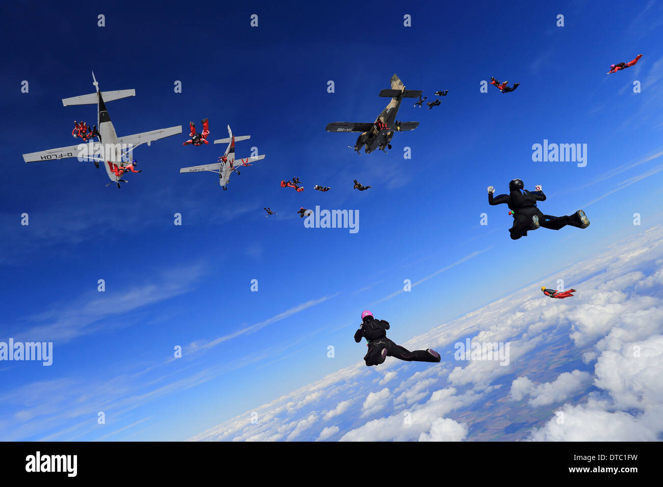 Large formation skydiving exit from multiple aircraft Stock Photo