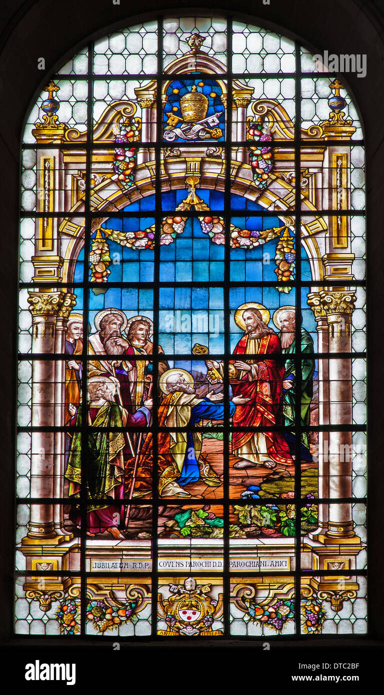 BRUSSELS, BELGIUM - JUNE 21, 2012: Jesus gives the keys of kingdom of heaven. Windowpane from Saint John the Baptist church. Stock Photo