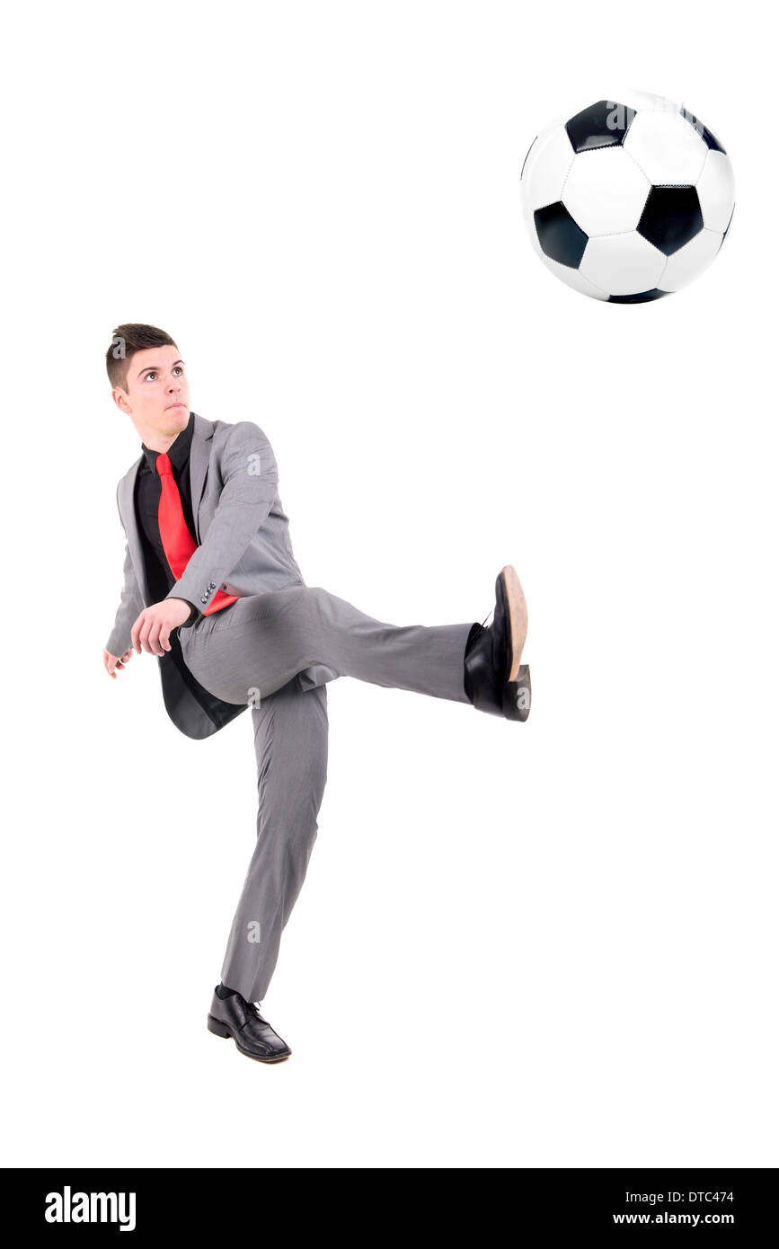 Businessman playing soccer ball isolated in white Stock Photo - Alamy
