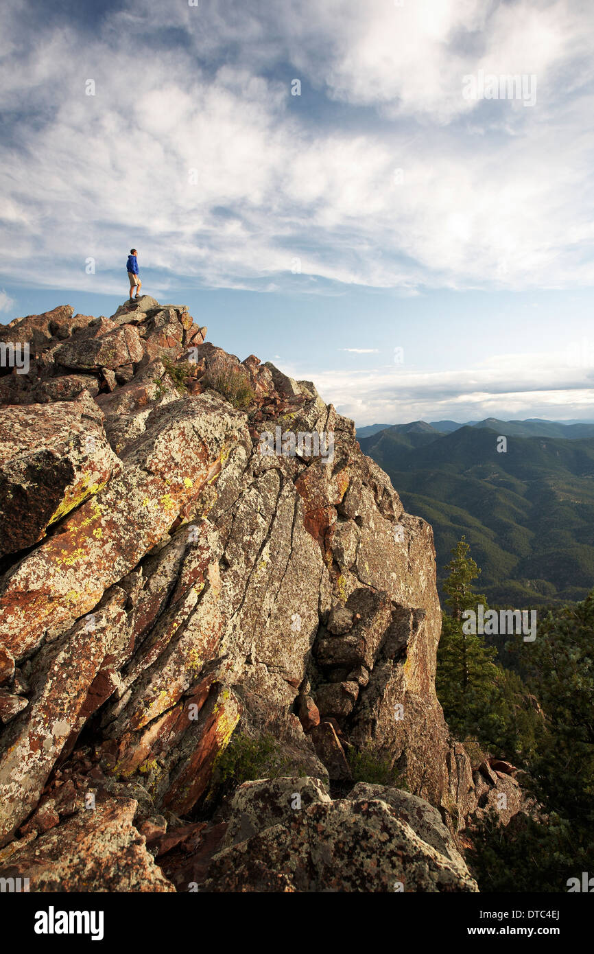Man standing on rock formation, Boulder, Colorado, USA Stock Photo