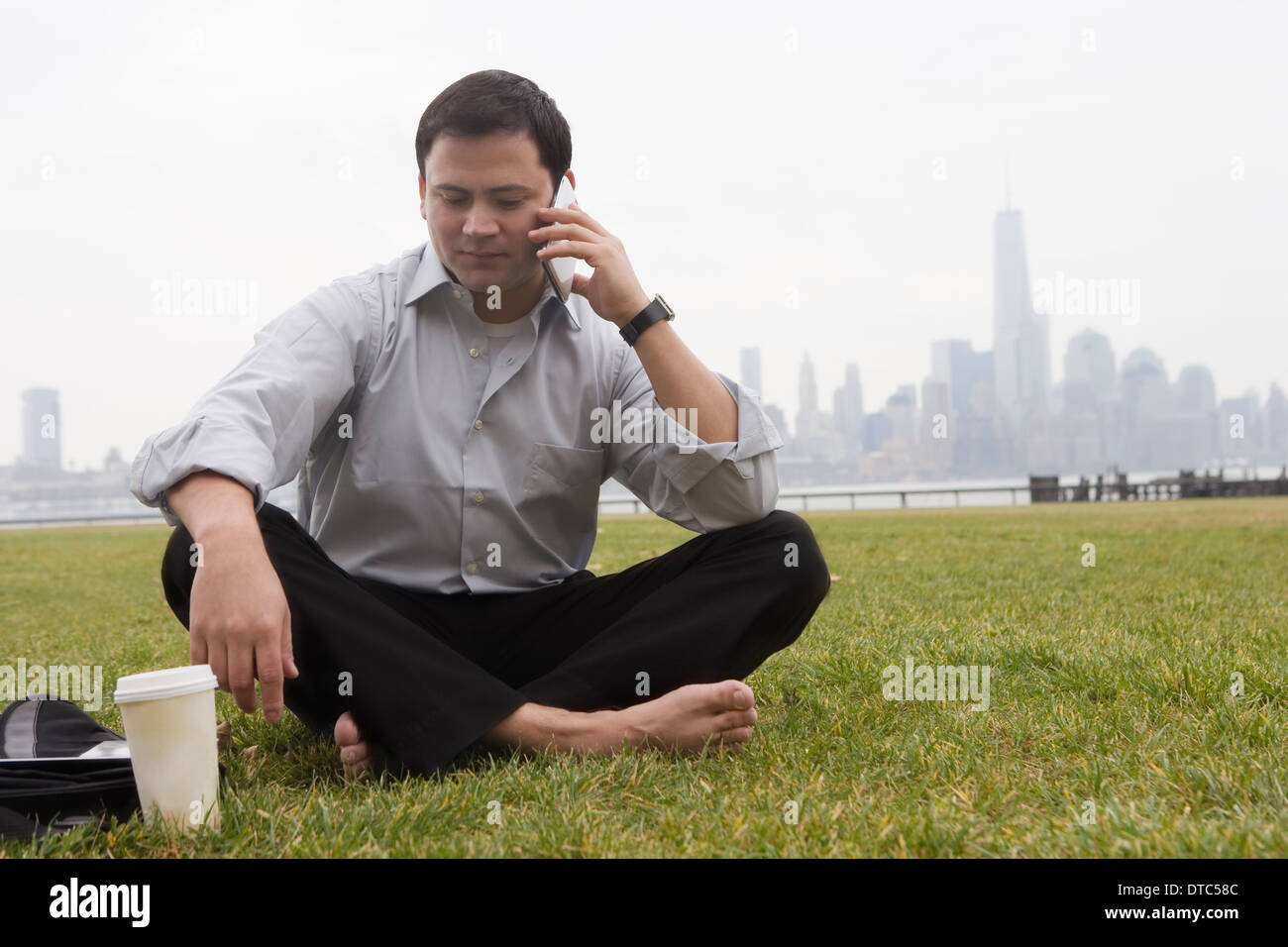 Businessman using cellular phone, Hoboken, New Jersey, USA Stock Photo
