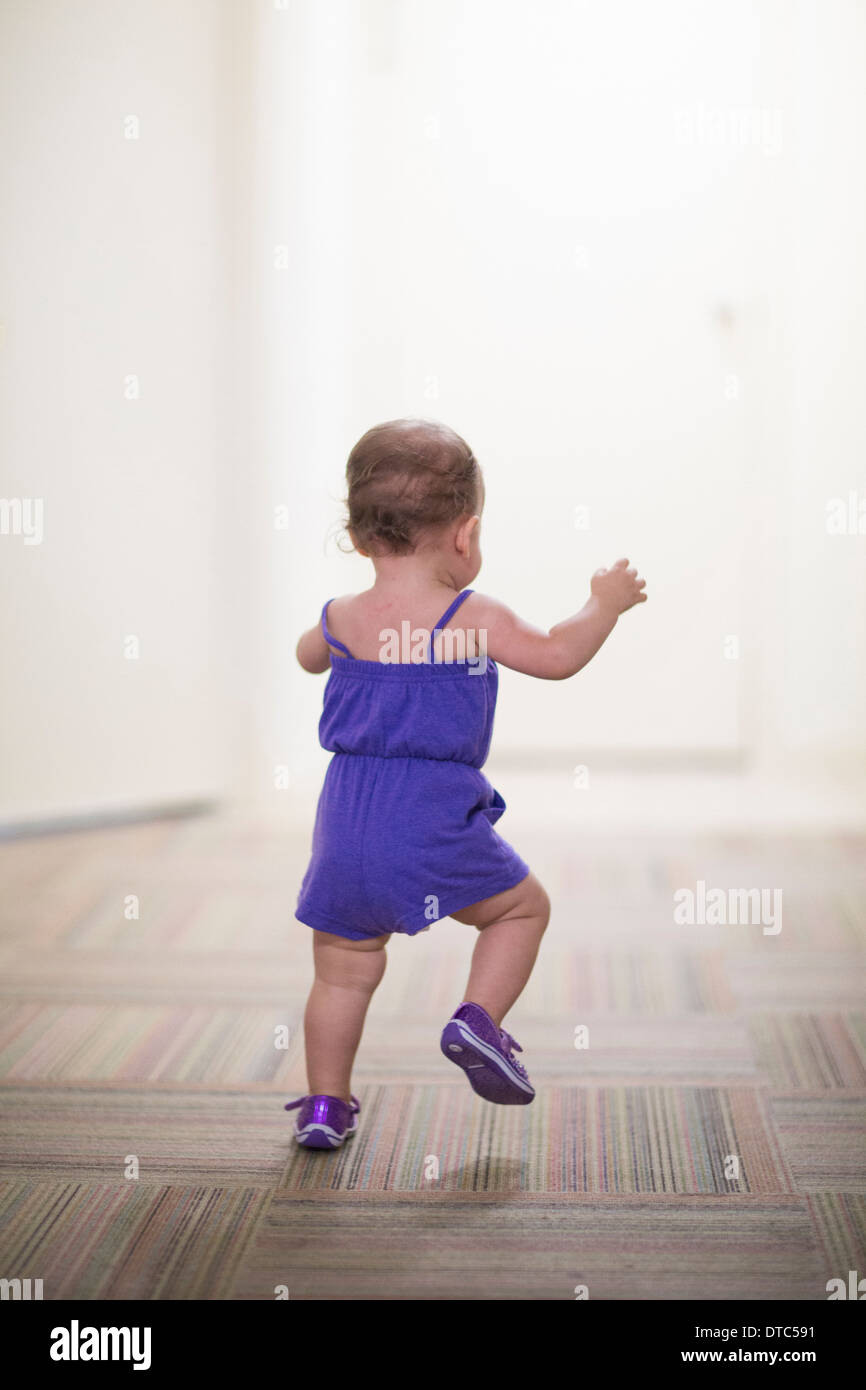 Toddler girl learning to walk Stock Photo Alamy