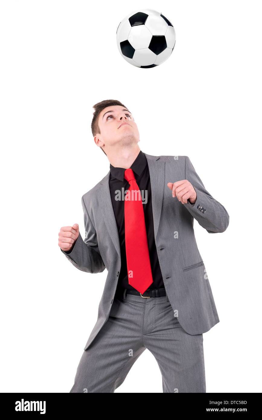 Businessman playing soccer ball isolated in white Stock Photo - Alamy