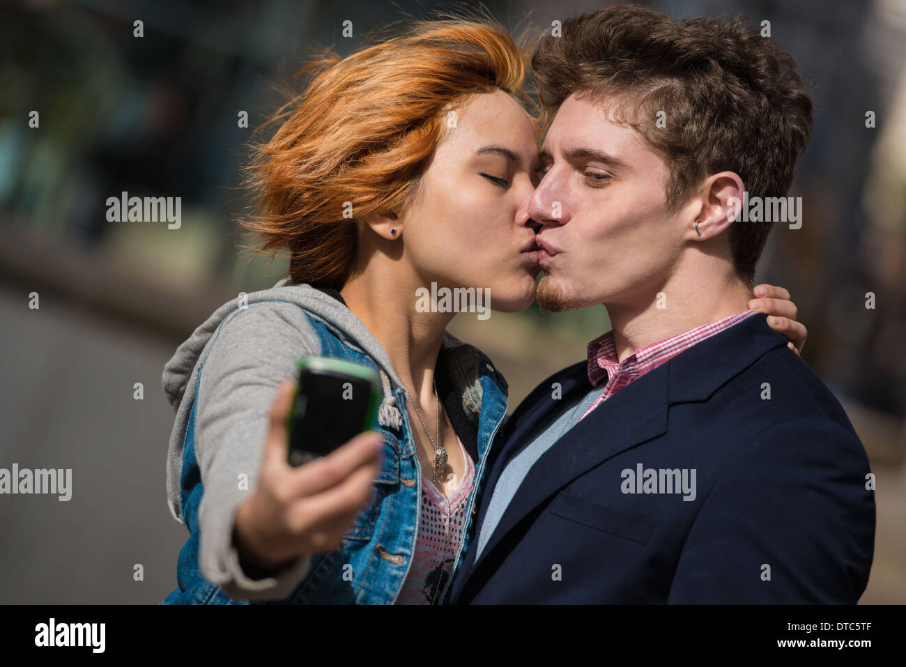 Couple taking selfies in the city Stock Photo