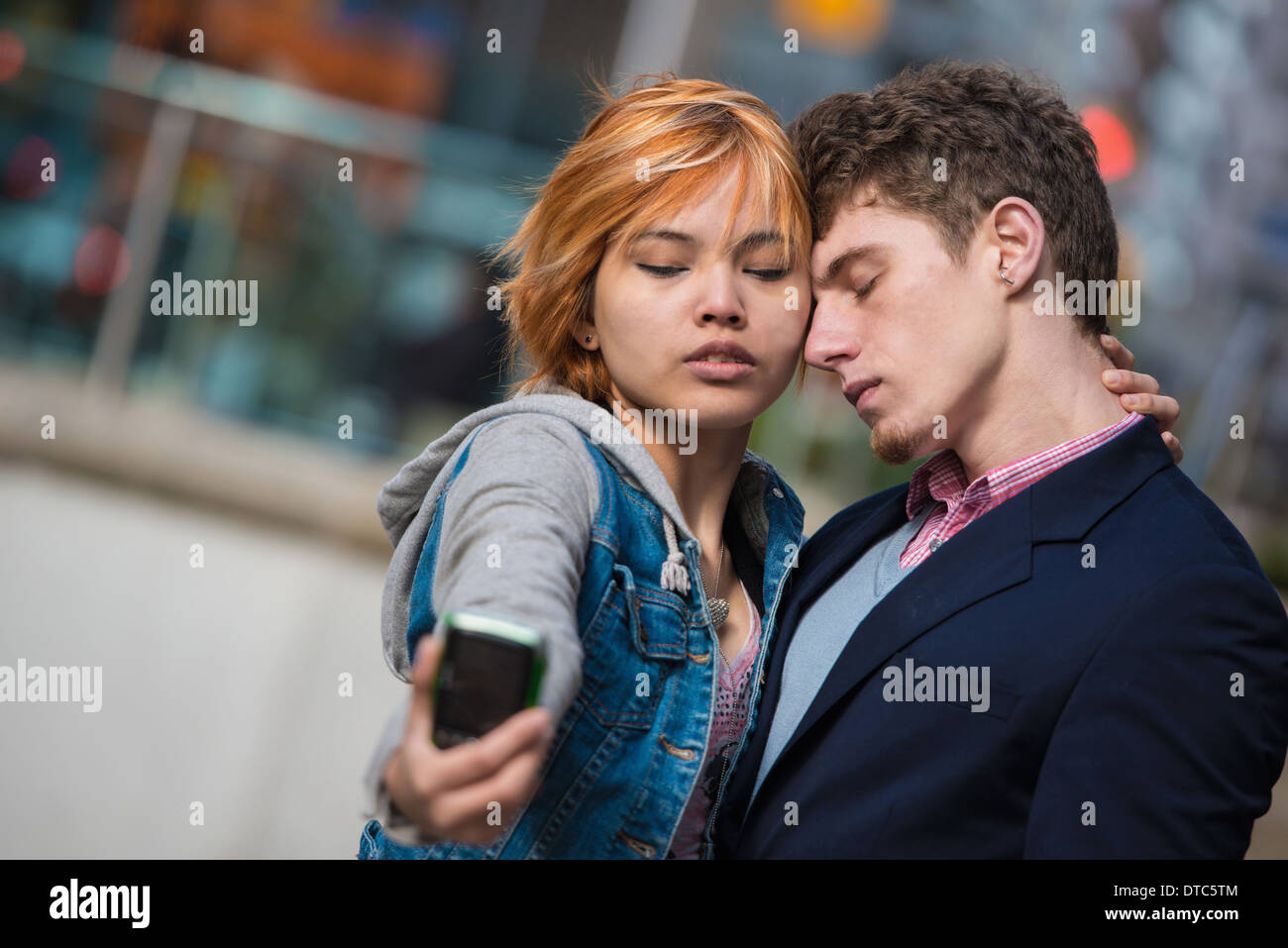 Couple taking selfies in the city Stock Photo