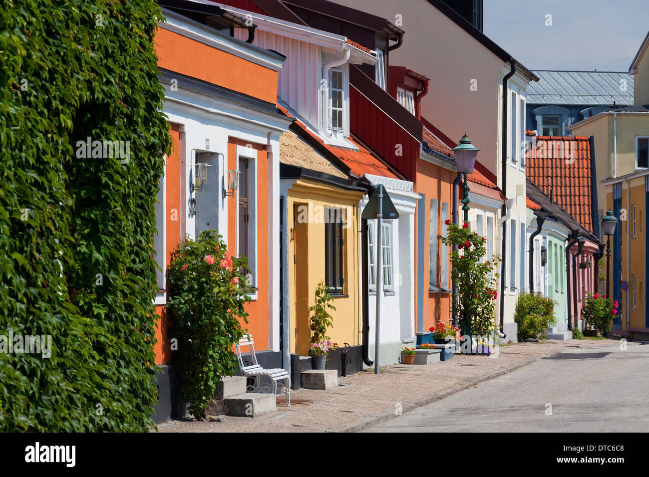 Historical and colourful houses with facades decorated with flowers in the town Ystad, Skåne / Scania, Sweden Stock Photo