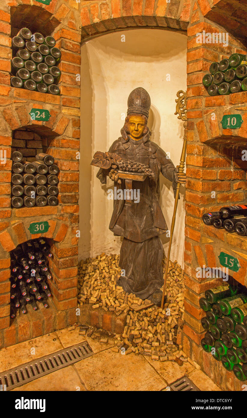 BRATISLAVA, SLOVAKIA - JANUARY 23, 2014: Saint Urban carved statue from interior of wine cellar of great Slovak producer. Stock Photo