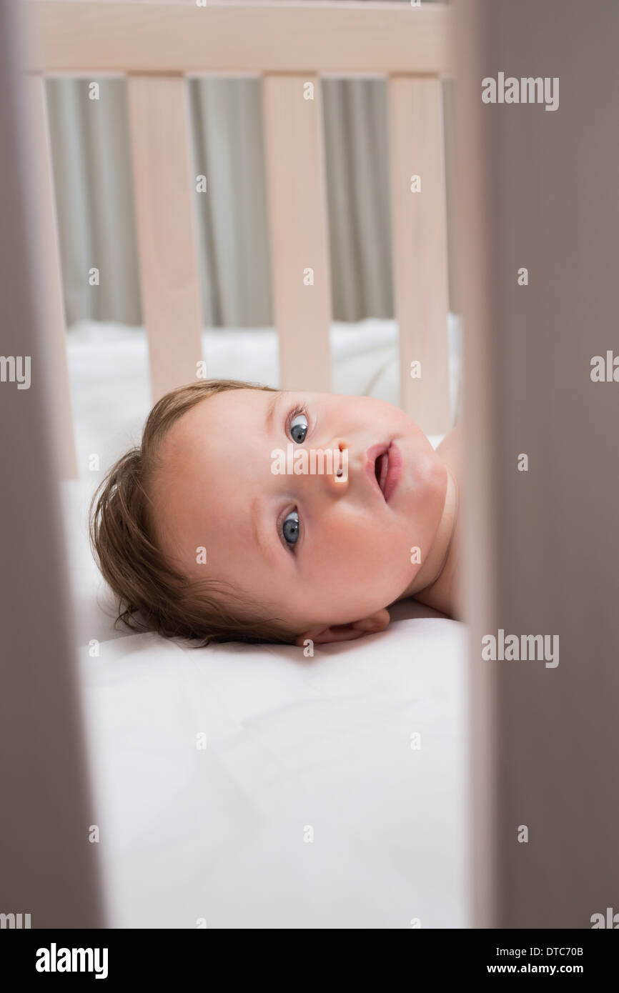 Portrait of baby in crib Stock Photo