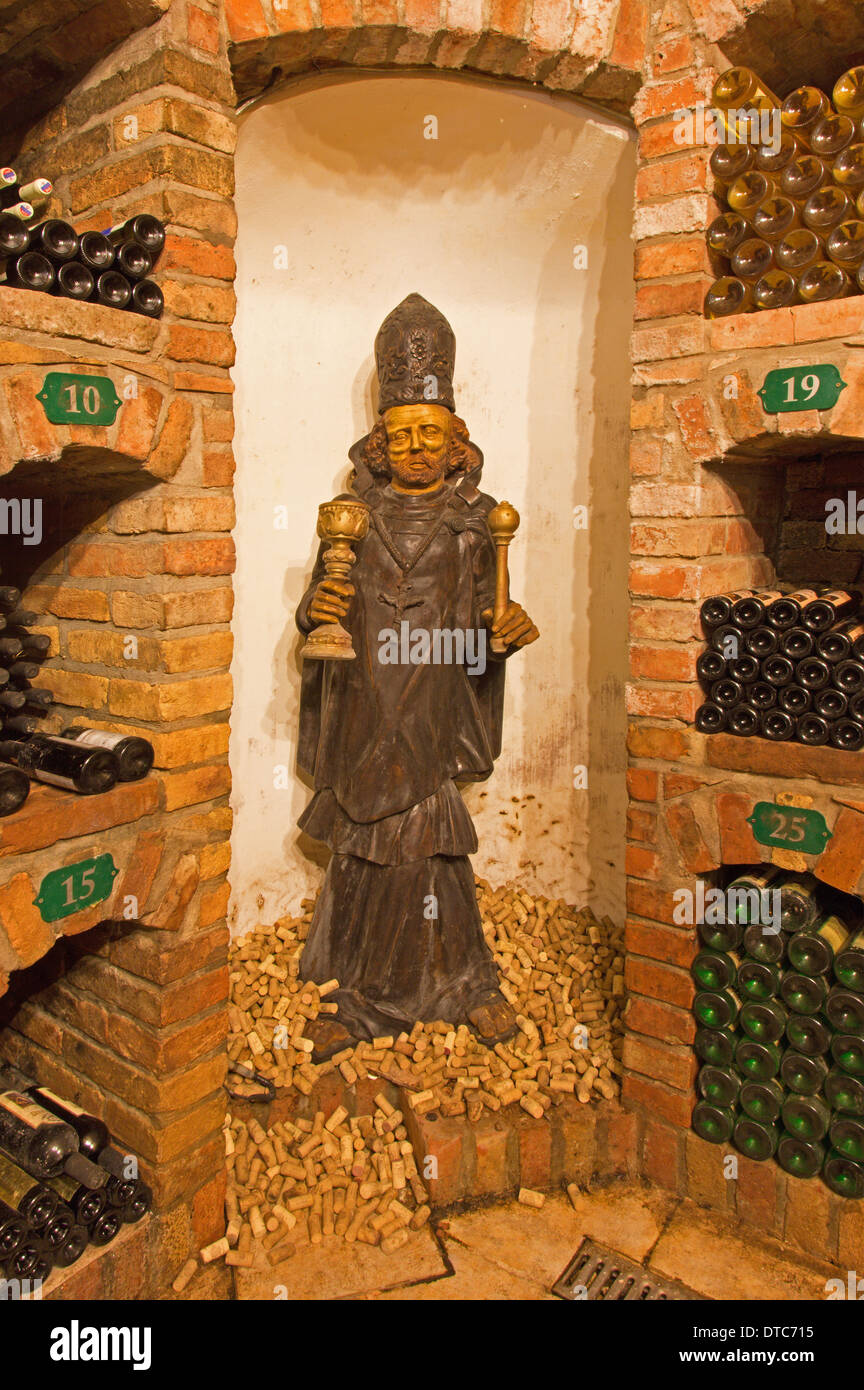 BRATISLAVA, SLOVAKIA - JANUARY 23, 2014: Saint John carved statue from interior of wine cellar of great Slovak producer. Stock Photo