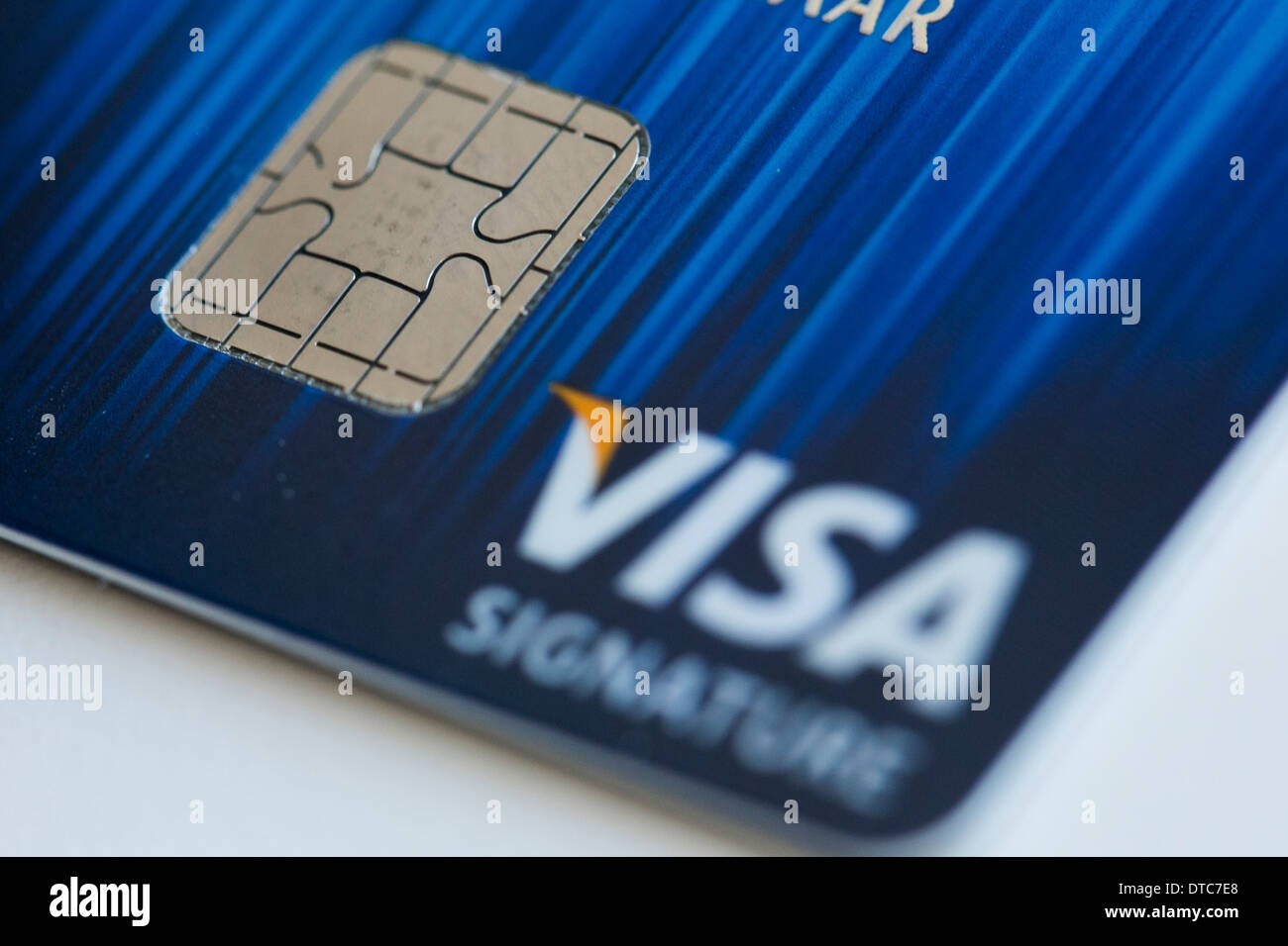 A Visa credit card featuring an EMV chip, also known as 'chip and PIN' juxtaposed with a magnetic strip card. Stock Photo