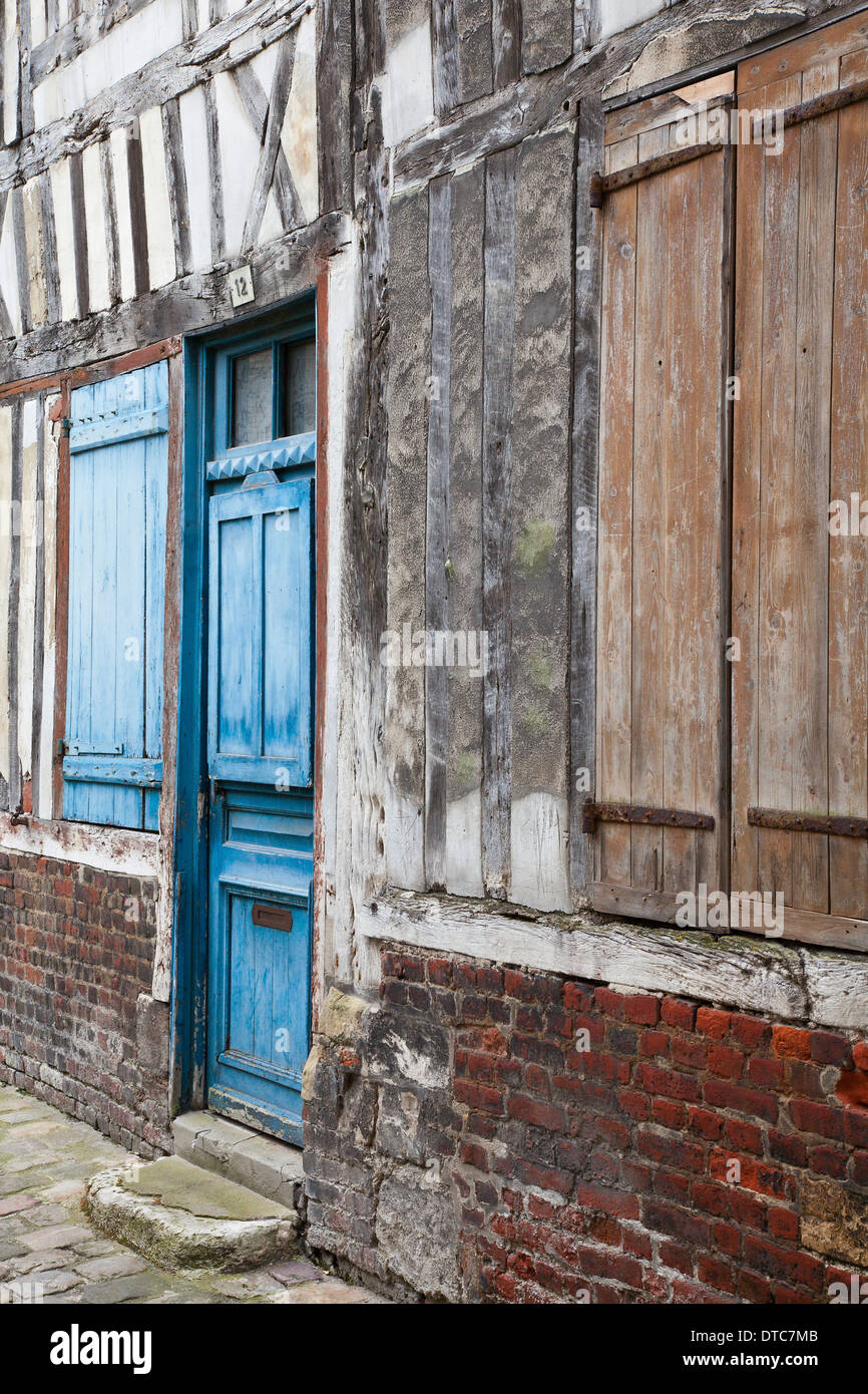 Painted shutters and door of a 16th century half-timbered building in Honfleur, Normandy, France Stock Photo