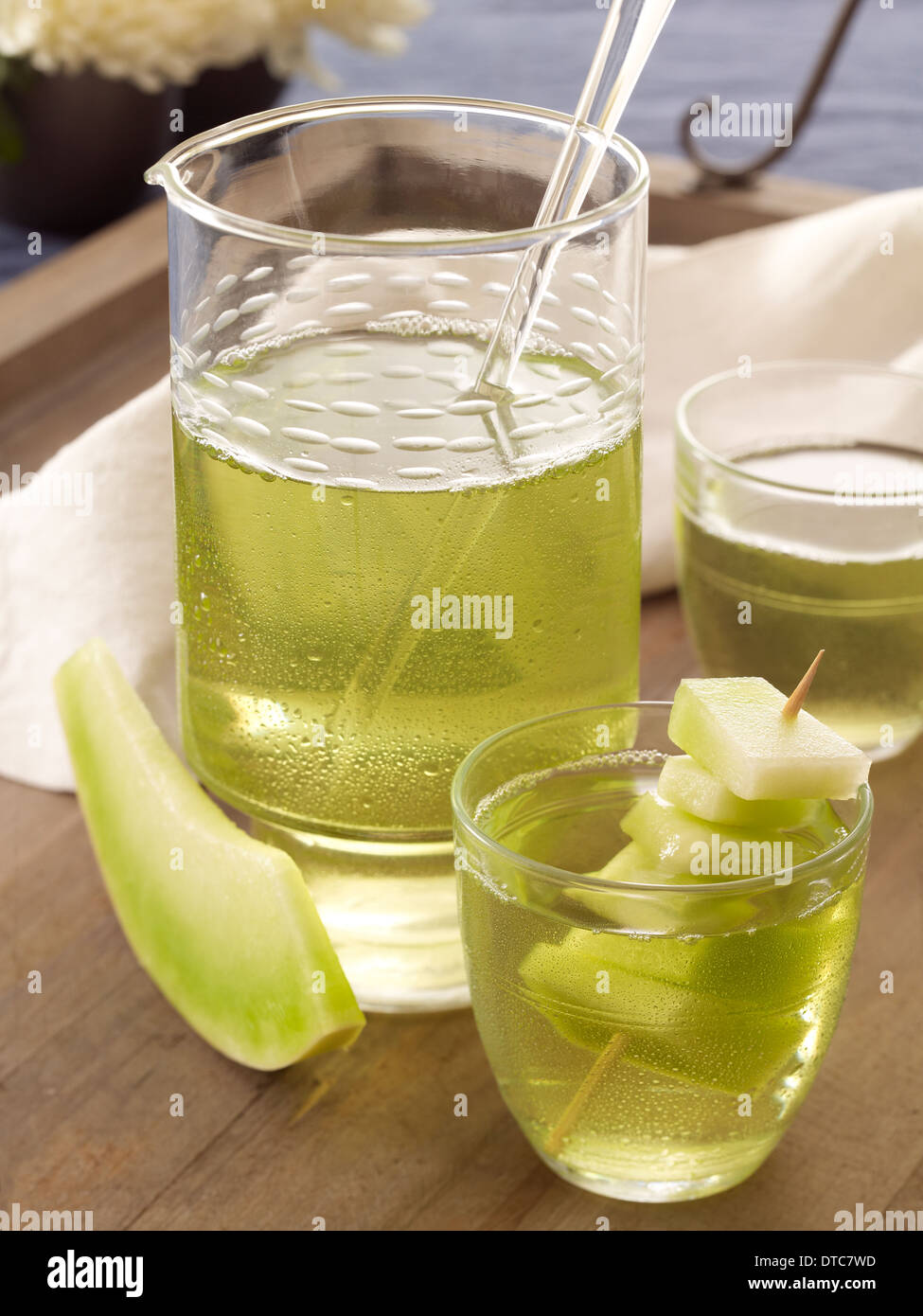 Melon liqueur cocktail with fresh melons in clear drinking glasses on