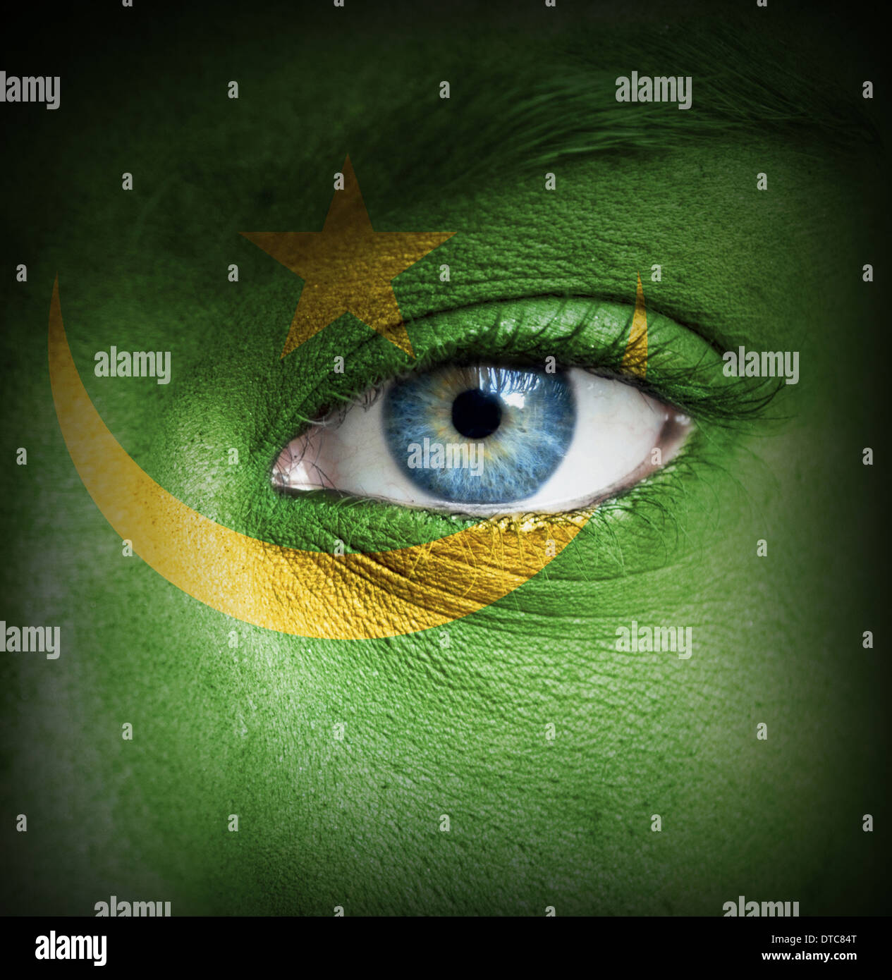 Human face painted with flag of Mauritania Stock Photo