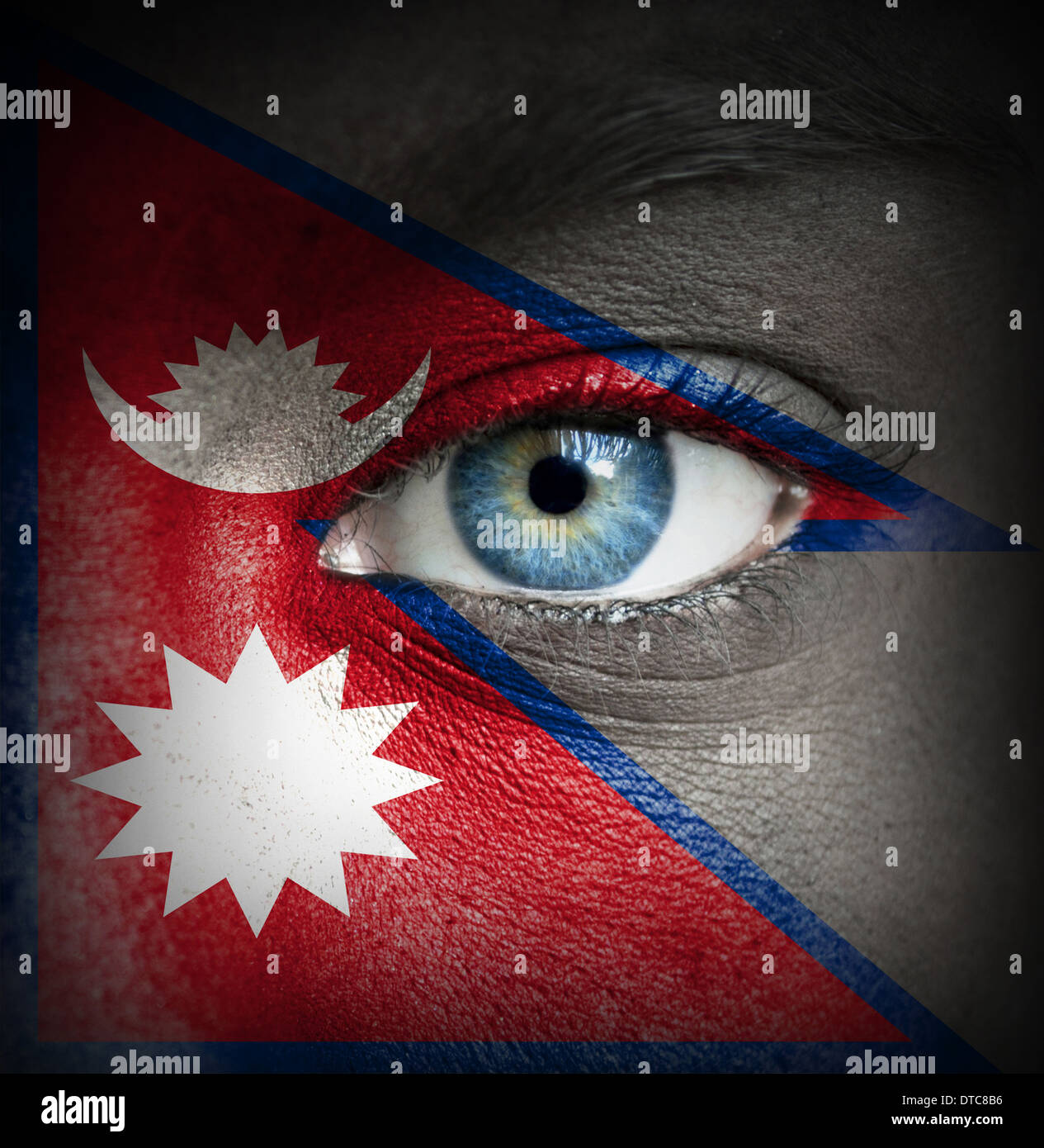 Human face painted with flag of Nepal Stock Photo - Alamy