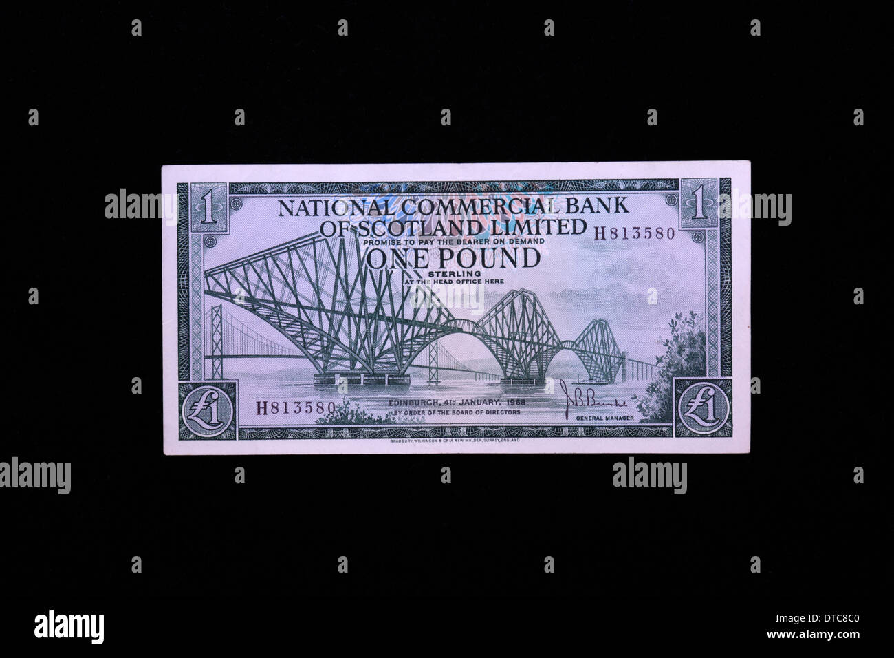 One Pound Sterling note with image of Forth Rail Bridge on black background, issued by National Commercial Bank of Scotland Stock Photo
