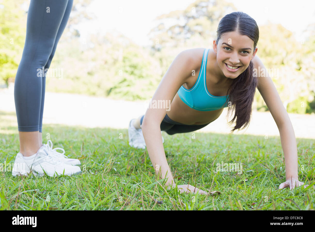 Woman doing push ups in the park hi-res stock photography and images ...