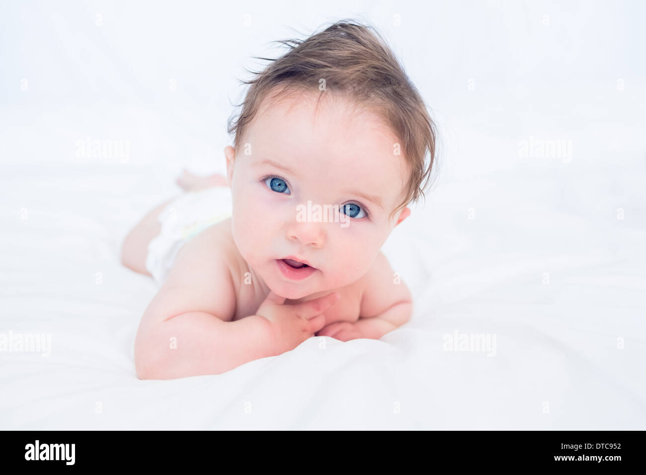 Baby with blue eyes looking away Stock Photo