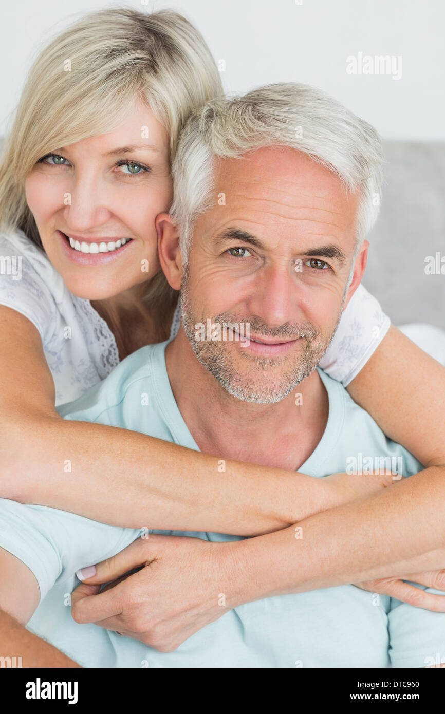 Portrait of a loving mature couple in bed Stock Photo