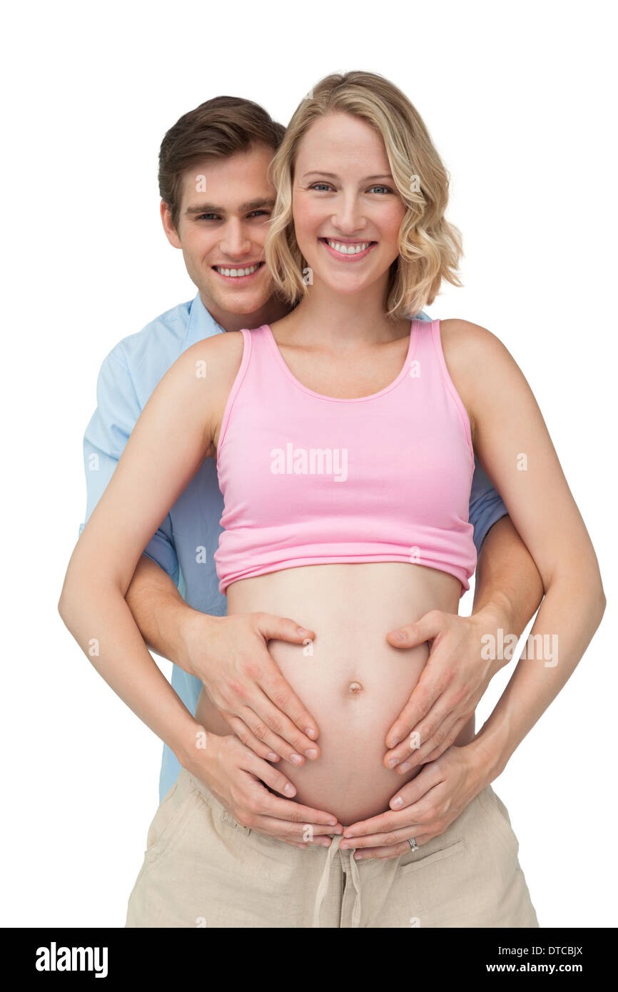 A playful pregnant woman is showing her baby bump Stock Photo - Alamy
