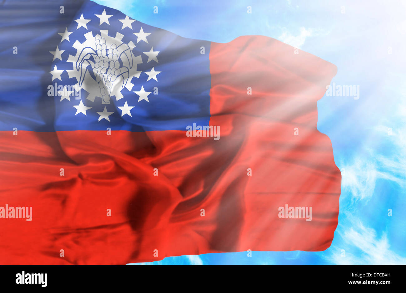Myanmar waving flag against blue sky with sunrays Stock Photo - Alamy