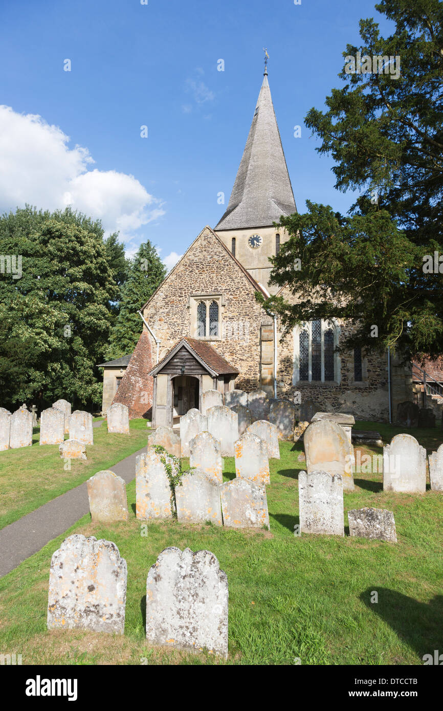 St James' Church, Shere, Surrey, southern England, a traditional village country church with spire and graveyard Stock Photo