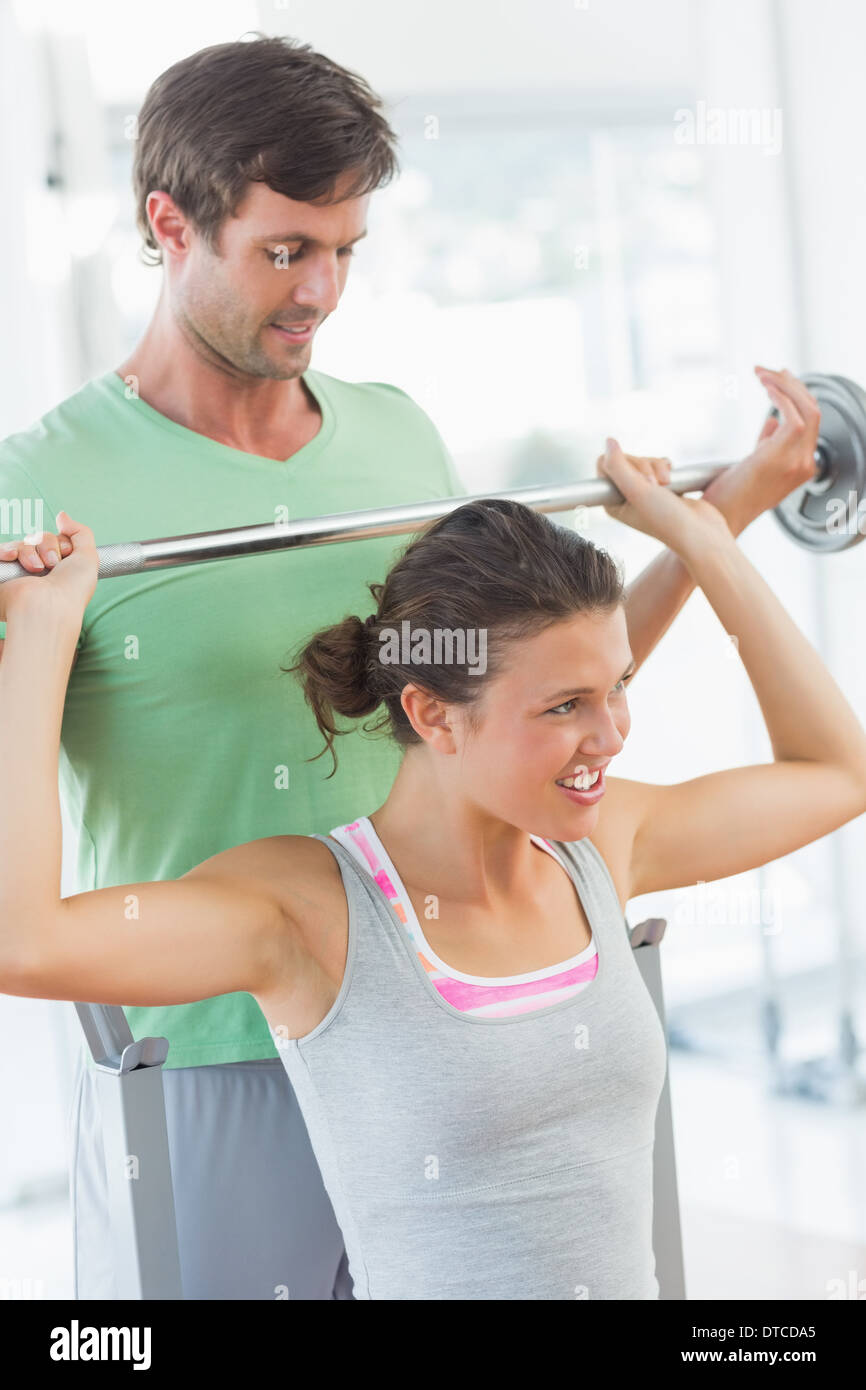 Fitness trainer assisting bench hi-res stock photography and images - Alamy