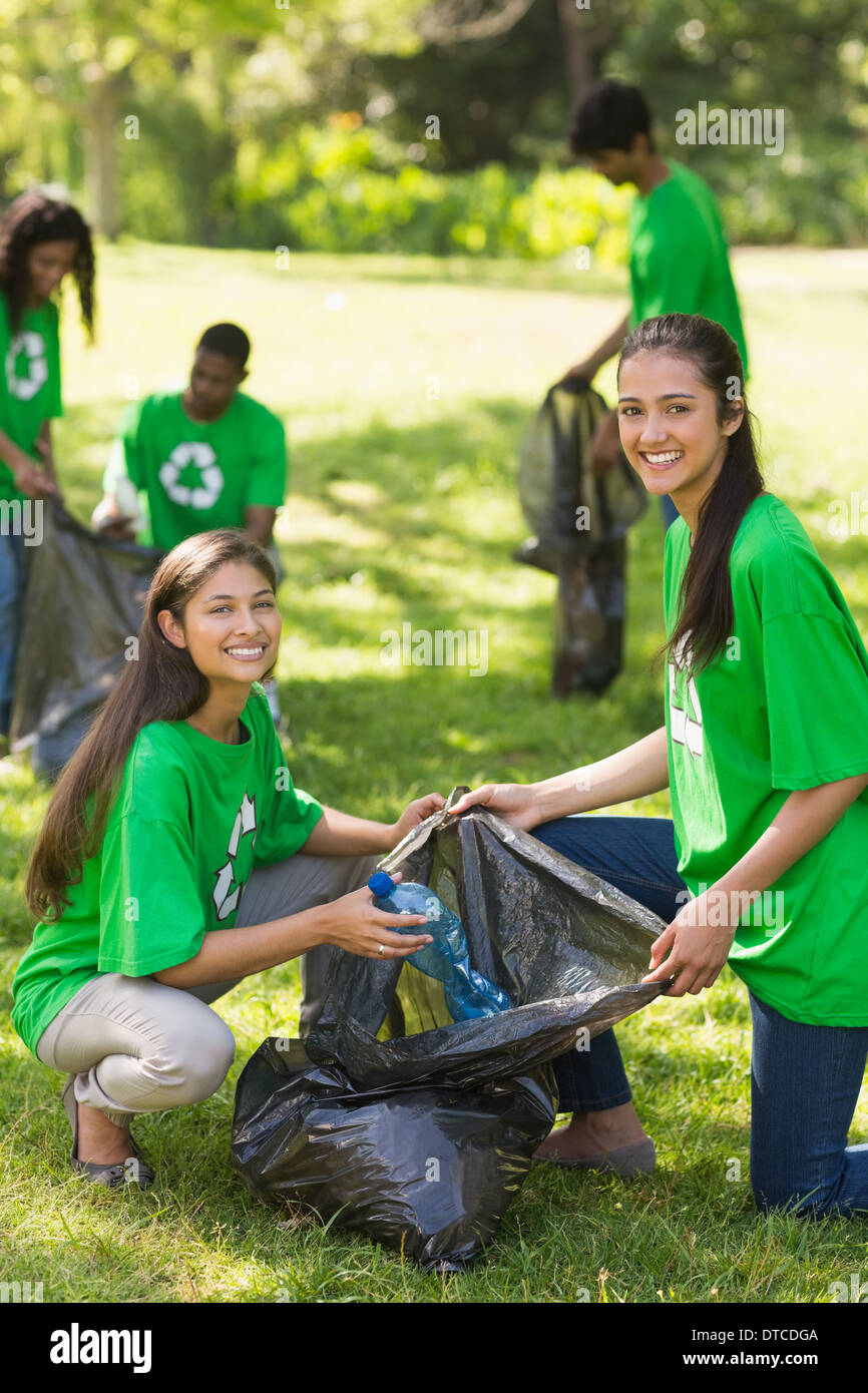 Volunteers picking up litter in park Stock Photo Alamy
