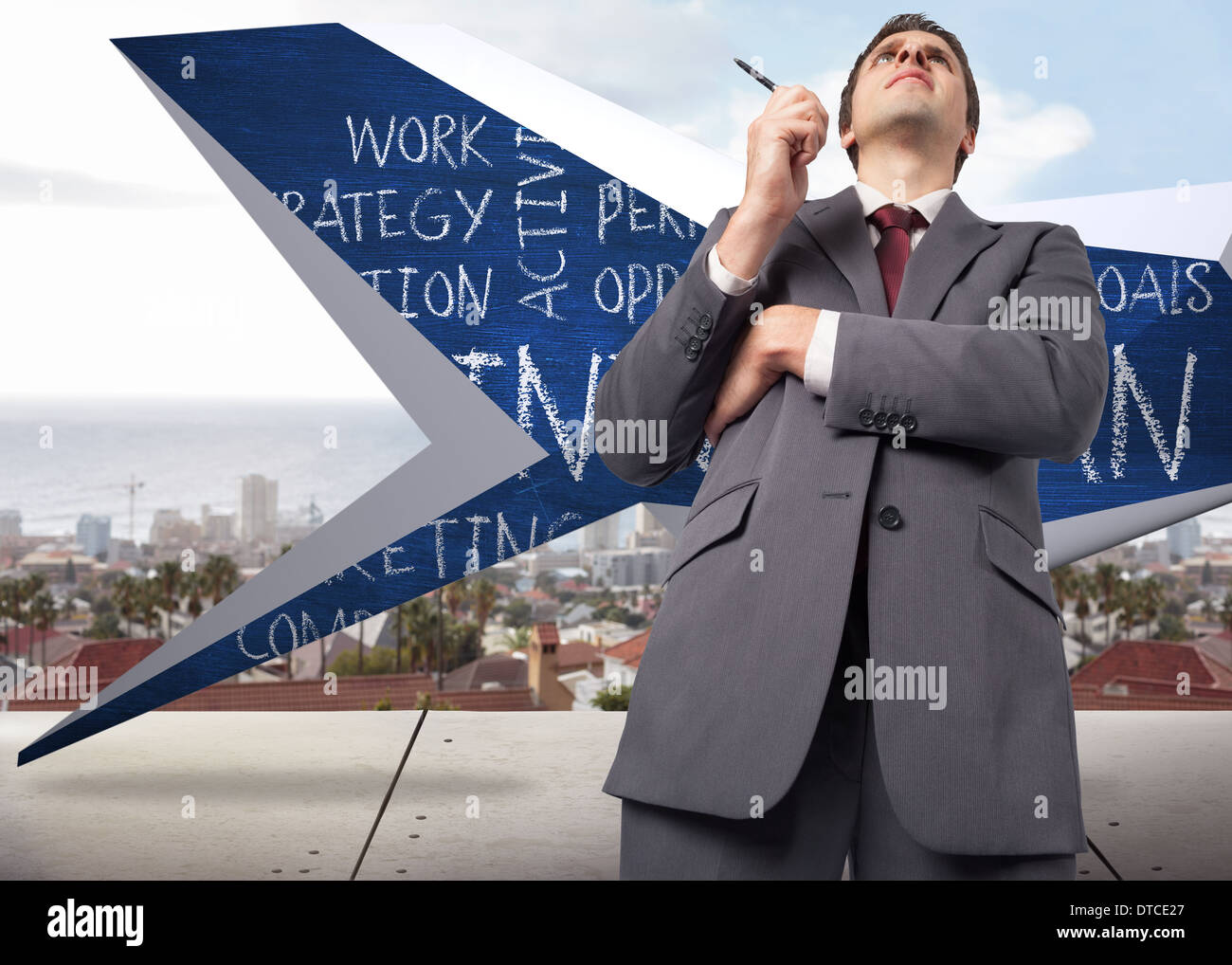 Composite image of thoughtful businessman holding pen Stock Photo - Alamy