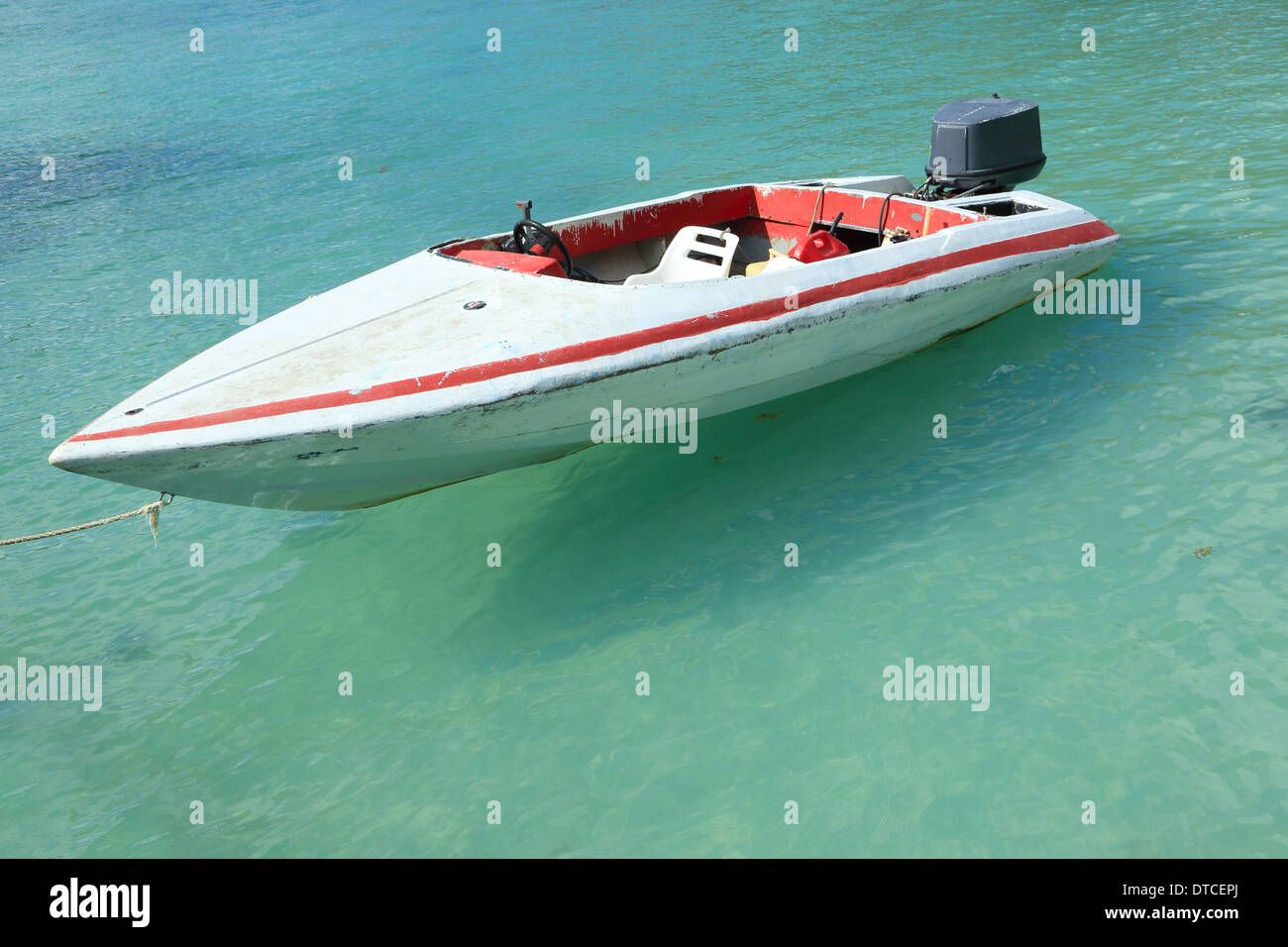 Motorboat on blue water in a sunny day Stock Photo