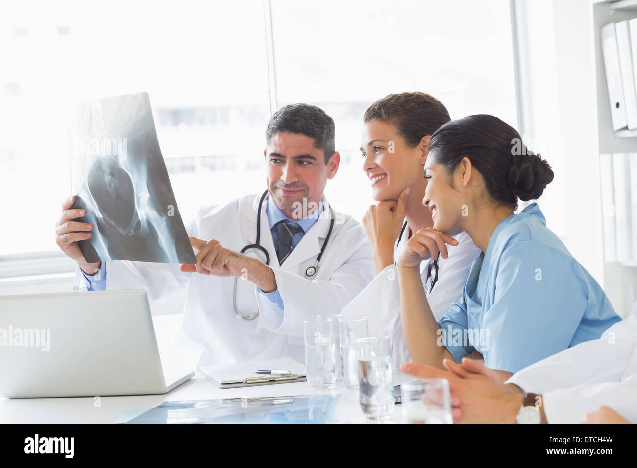 Smiling medical team analyzing xray Stock Photo - Alamy