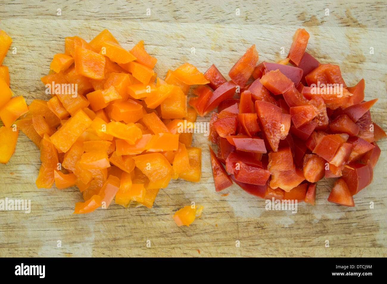 slices of colorful sweet bell pepper on wood board. Stock Photo