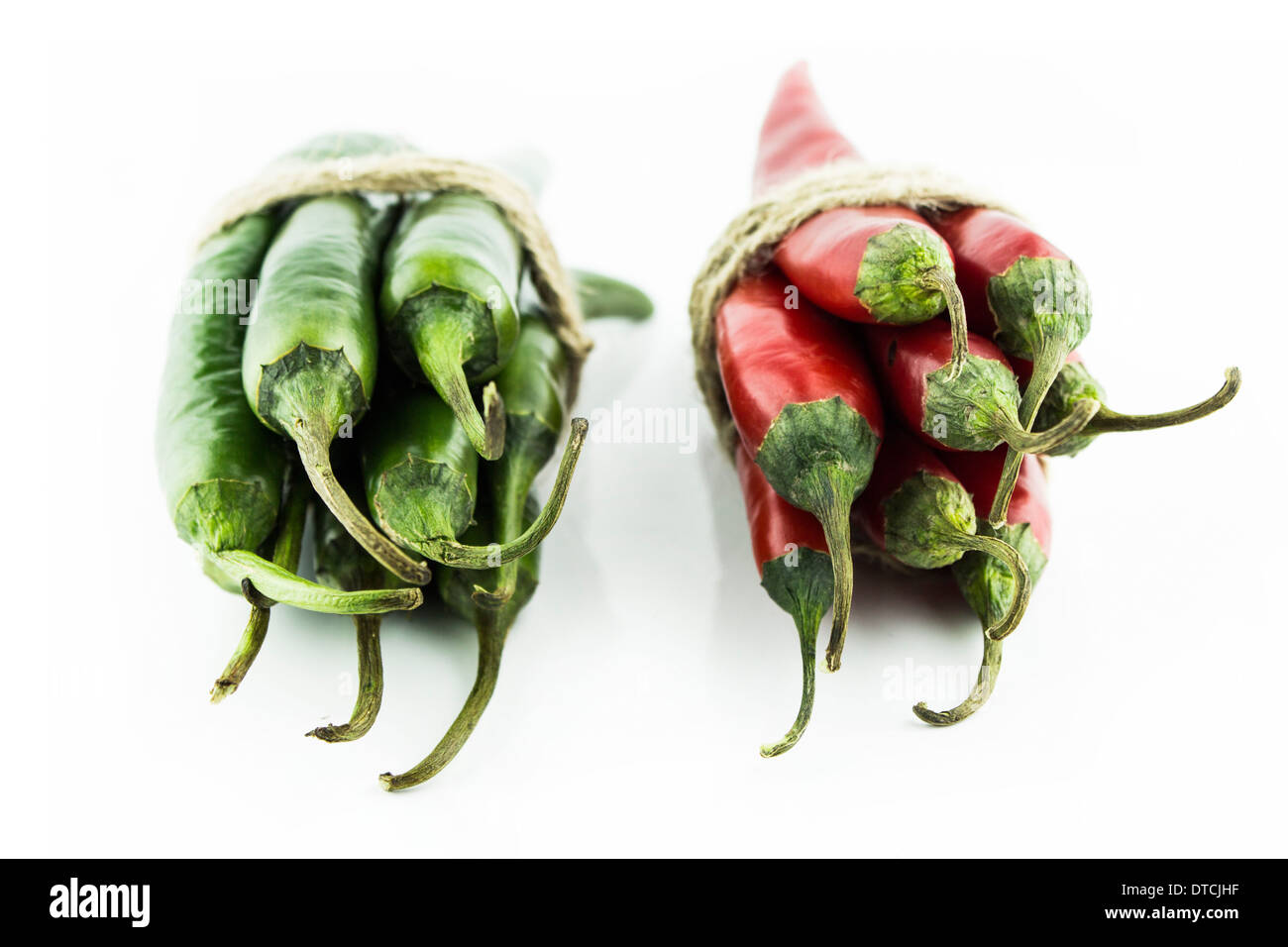 Two sets of red and green hot chili pepper on a white background Stock ...