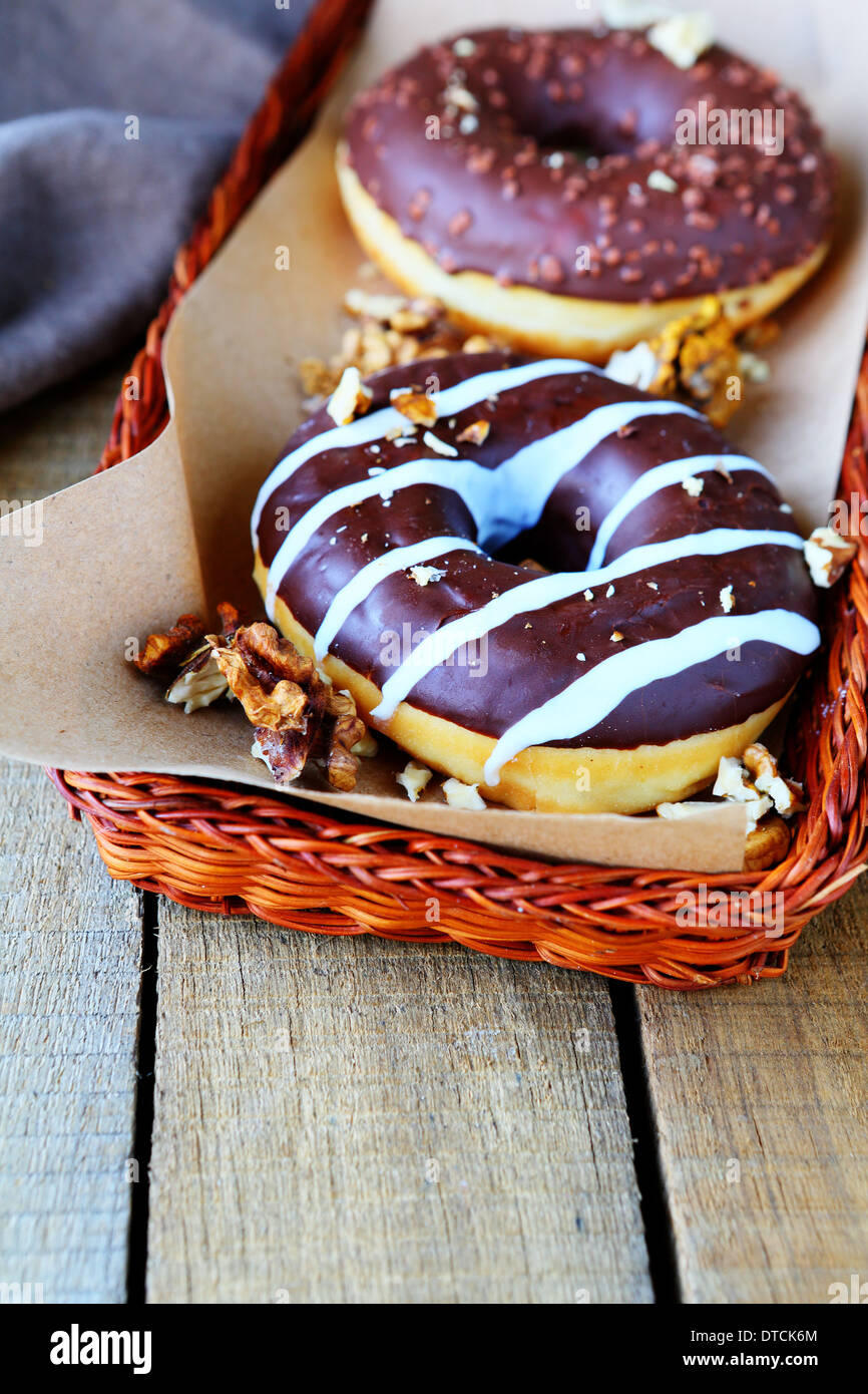 two chocolate donuts with nuts, food Stock Photo