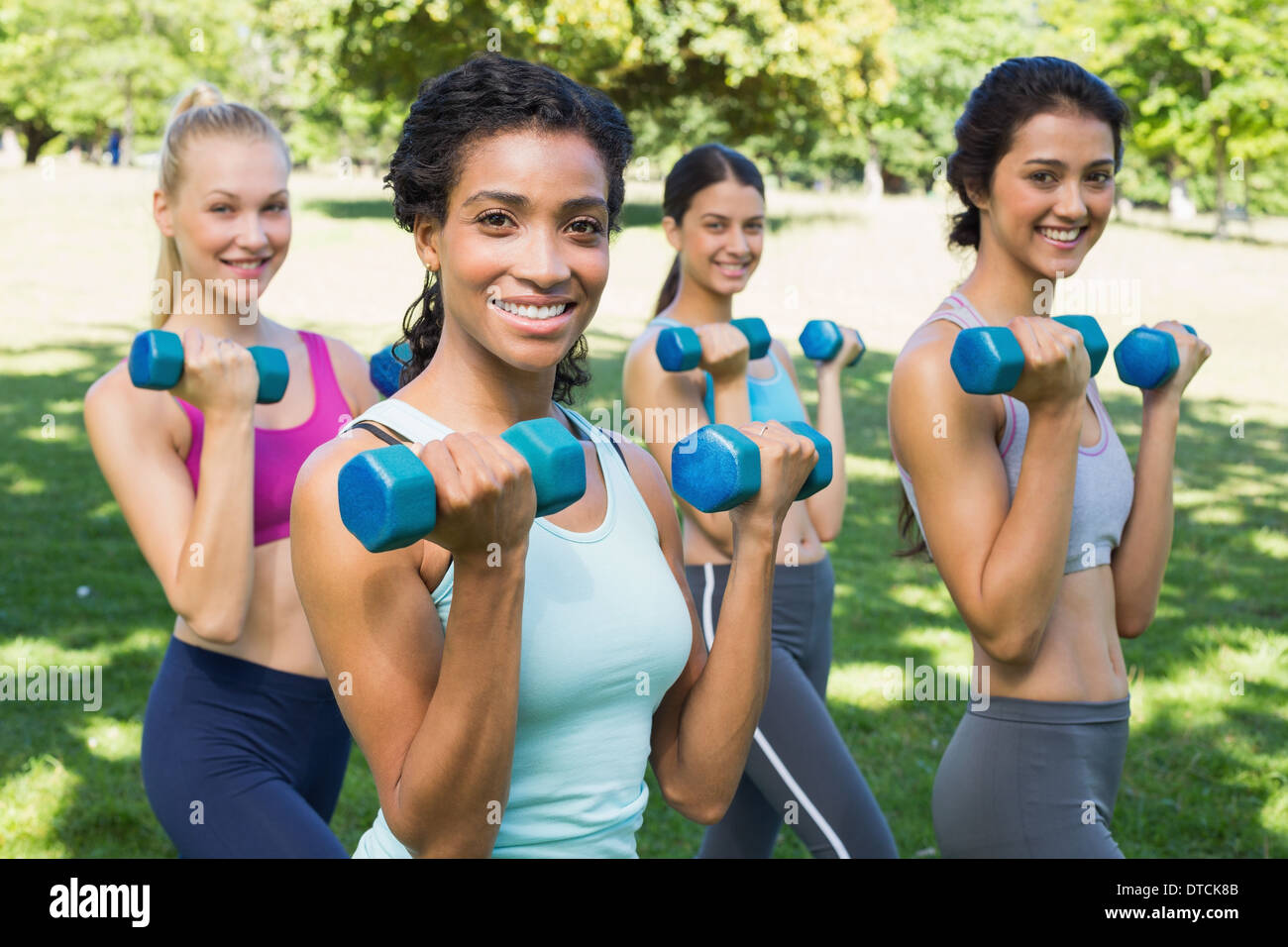 Confident sporty women lifting hands weights Stock Photo Alamy