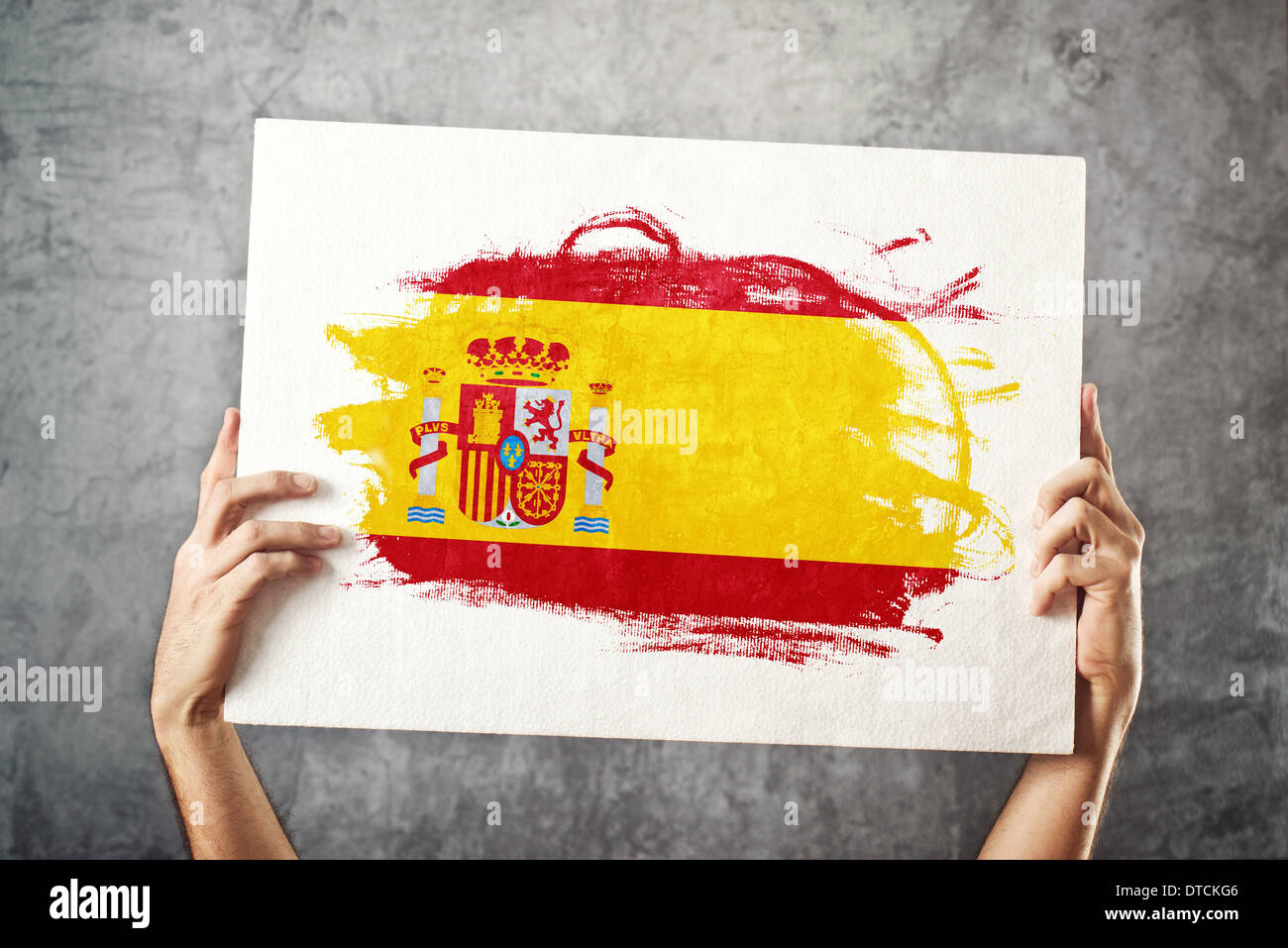 Spain flag. Man holding banner with Spanish Flag. Supporting national team, patriotism concept. Stock Photo