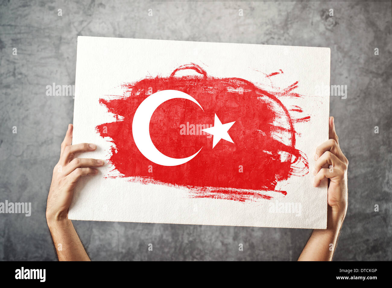 Turkey flag. Man holding banner with Turkish Flag. Supporting national team, patriotism concept. Stock Photo
