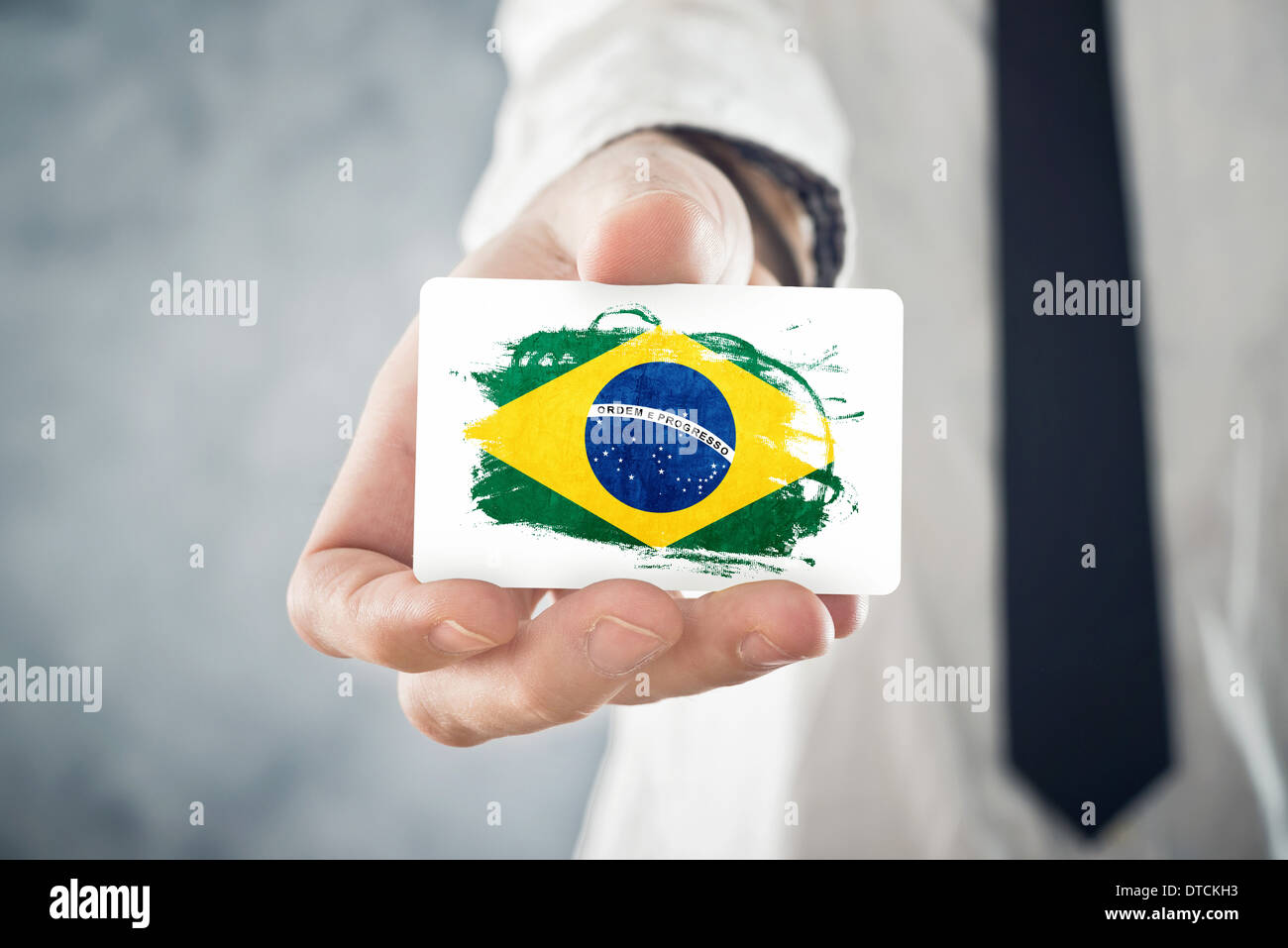Brazilian Businessman holding business card with Brazil Flag
