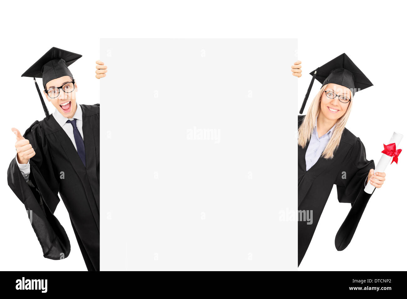 Two college students standing behind blank panel and gesturing success Stock Photo
