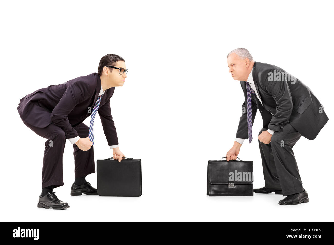 Two competitive businessmen standing in sumo wrestling stance Stock Photo