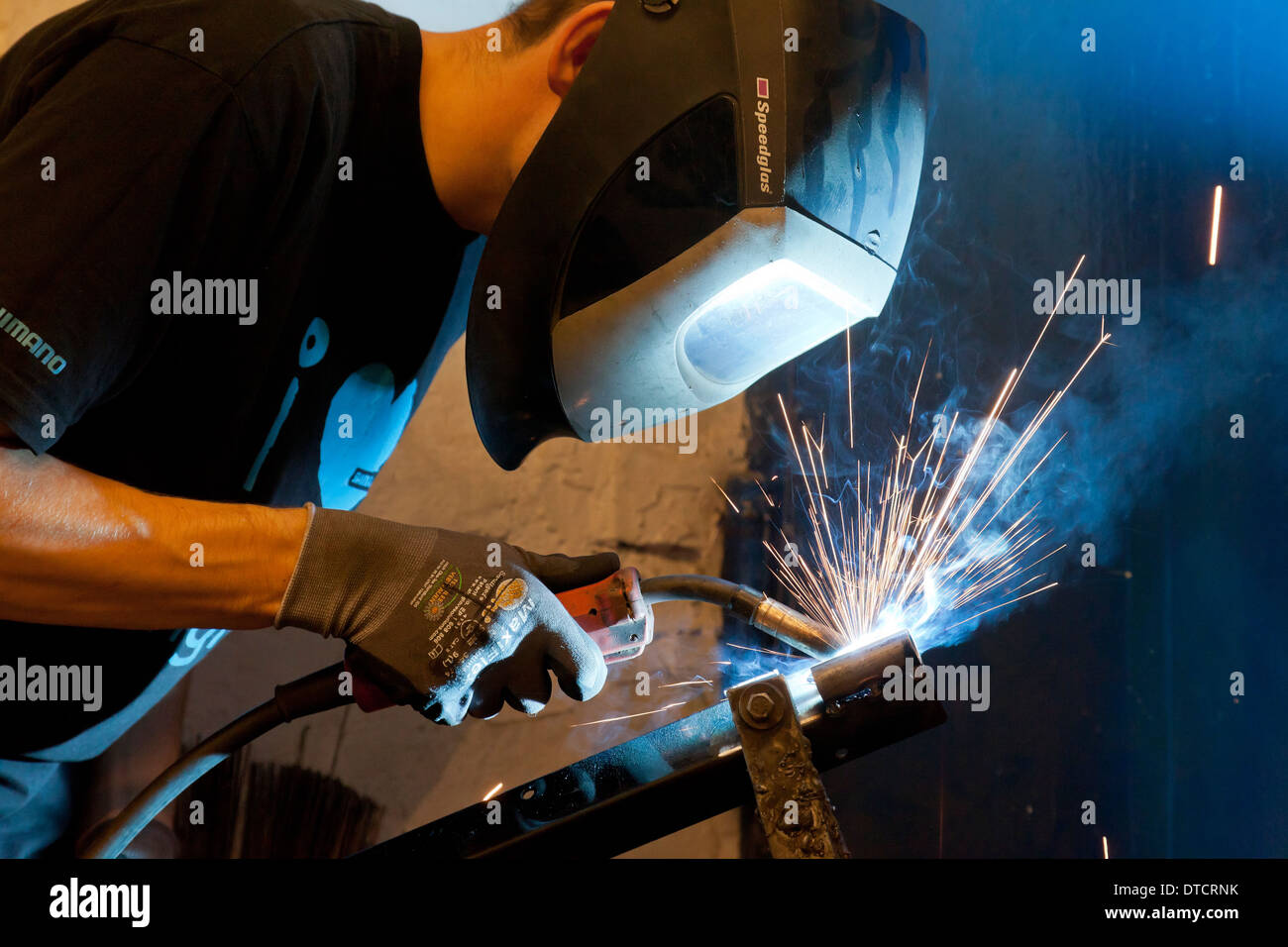 Berlin, Germany, welding on a frame holder in the of Ostrad