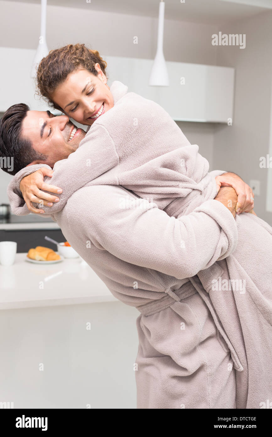 Man lifting woman in kitchen hi-res stock photography and images - Alamy
