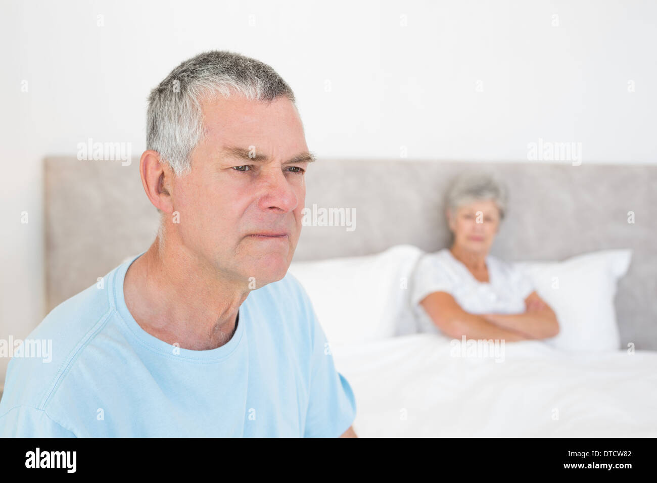 Sad man in bed wife hi-res stock photography and images - Alamy