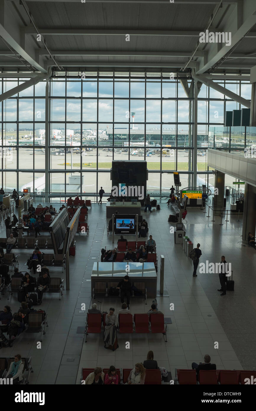 Passengers wait for departure in Heathrow Airport's Terminal Five building Stock Photo Alamy