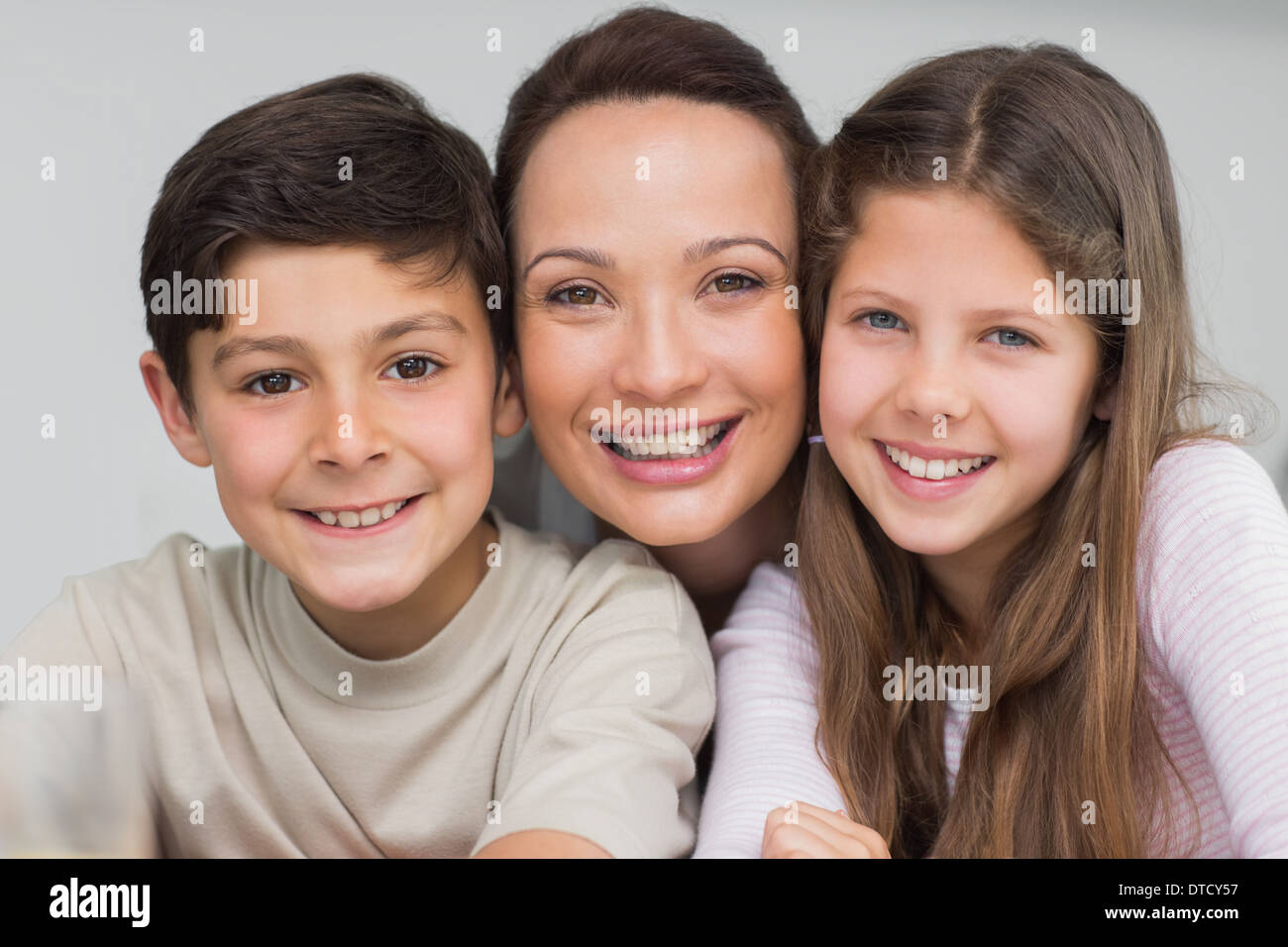 Closeup portrait of a mother with kids Stock Photo