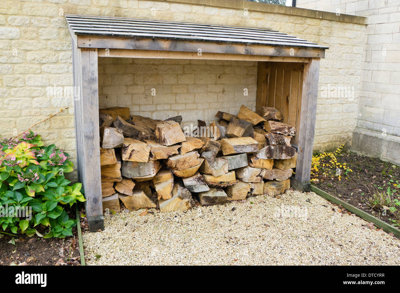 Wood pile England Cotswolds UK Stock Photo