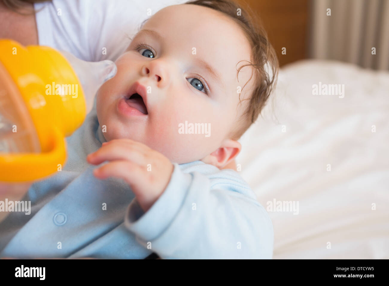 Baby being feed by mother Stock Photo