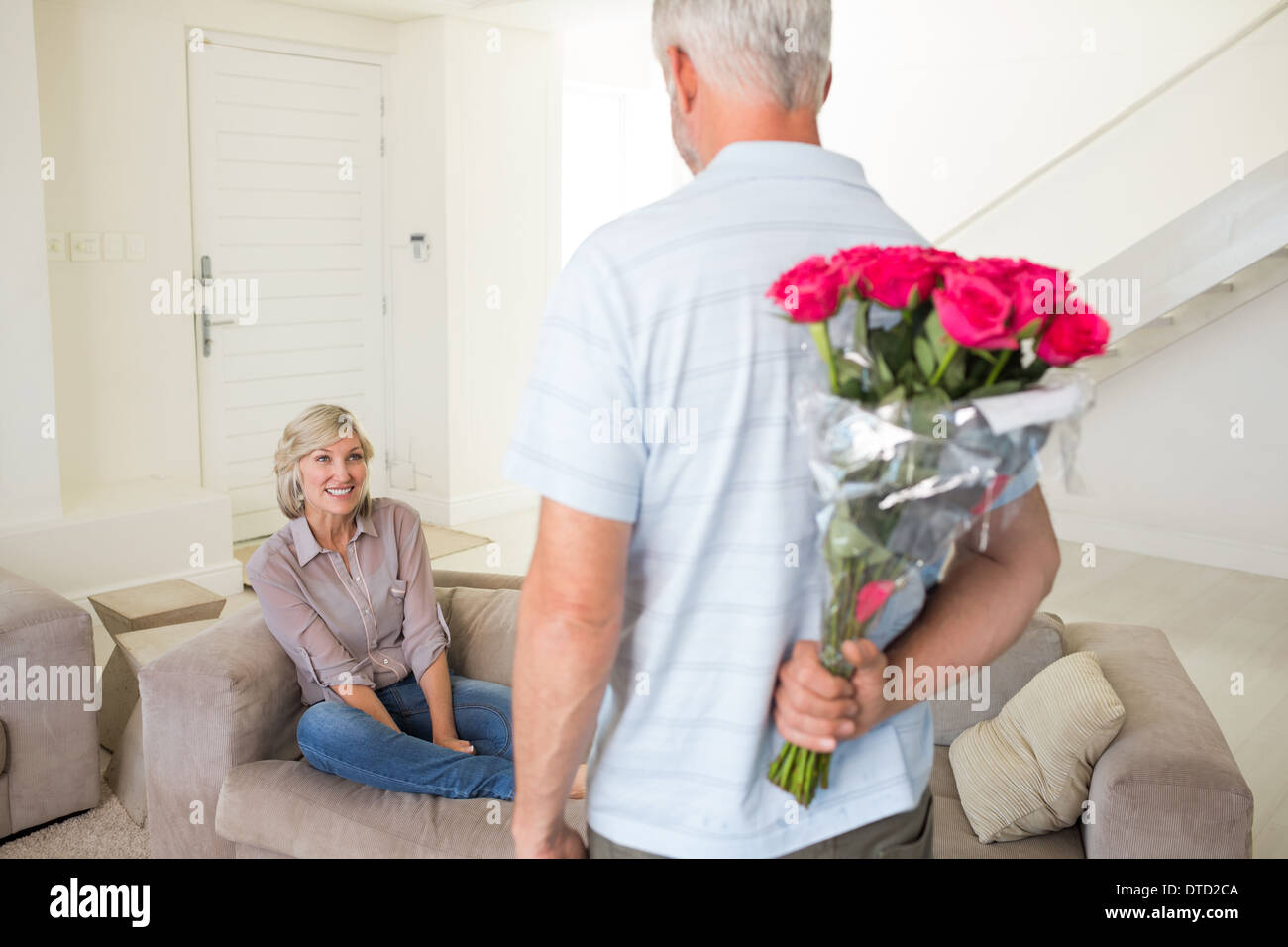 Woman standing behind man sitting hi-res stock photography and images ...