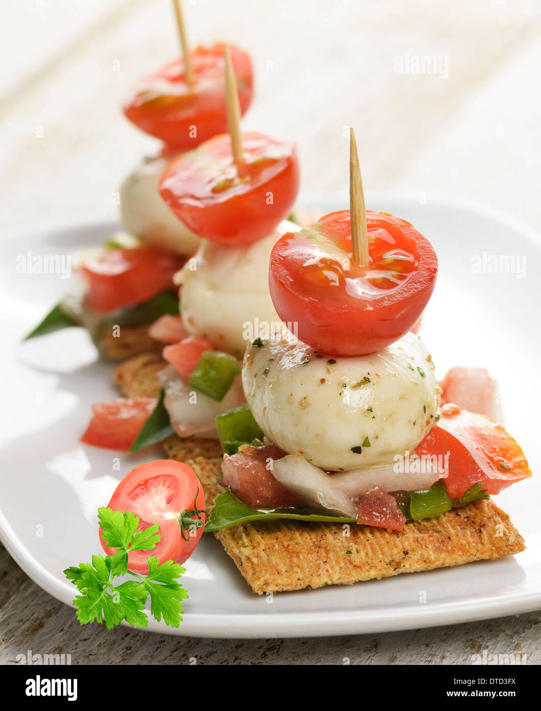 Crackers With Mozzarella Cheese And Tomatoes Stock Photo Alamy