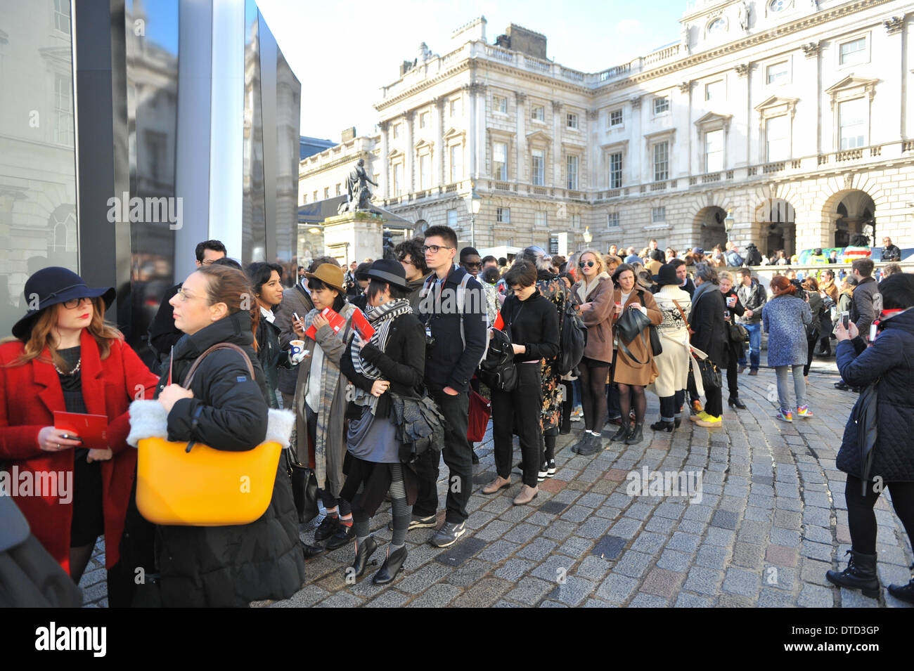Somerset House, London, UK. 15th February 2014. Visitors queue for a show in London Fashion Week at Somerset House . Credit:  Matthew Chattle/Alamy Live News Stock Photo