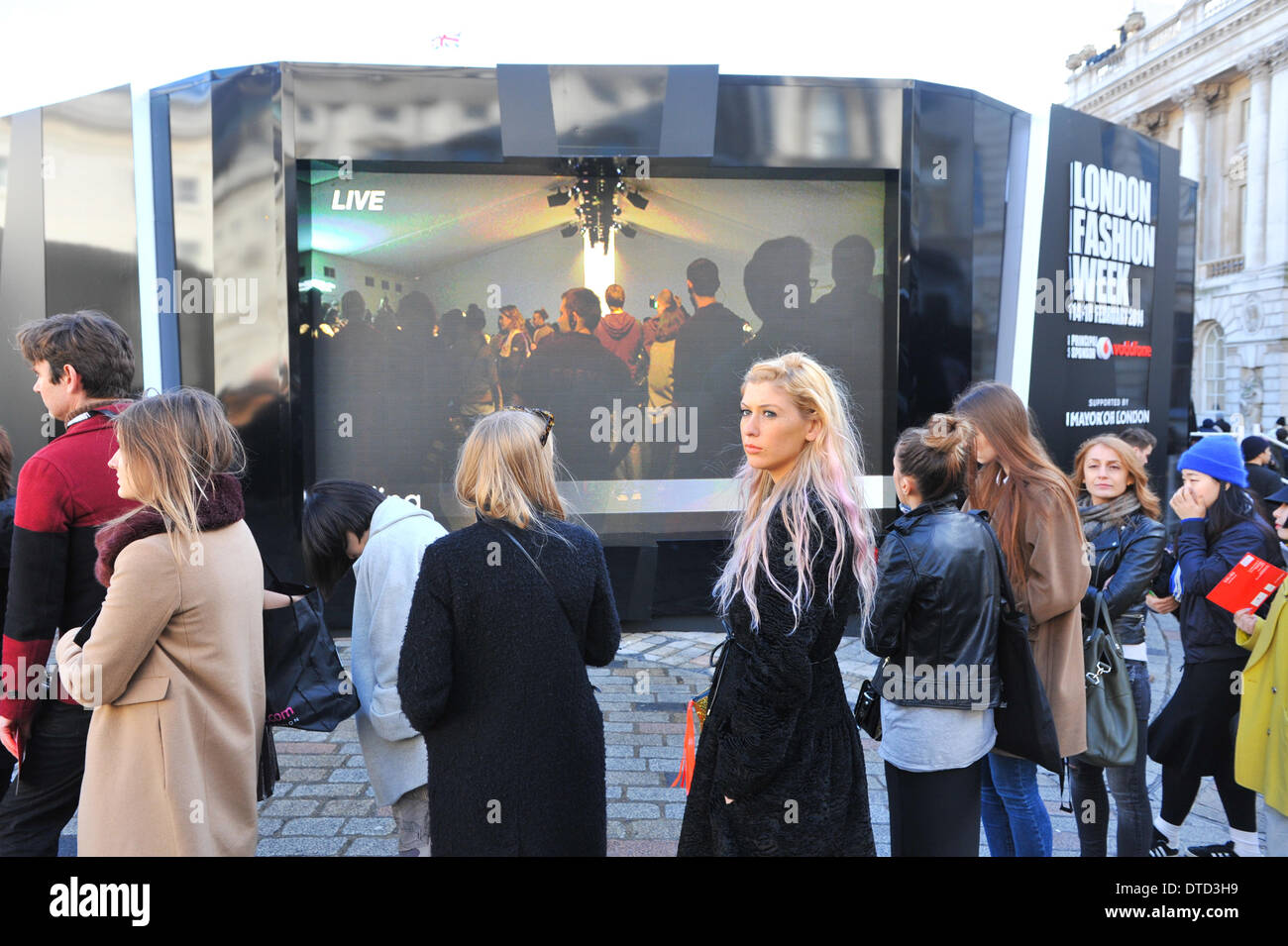 Somerset House, London, UK. 15th February 2014. Visitors queue for a show in London Fashion Week at Somerset House . Credit:  Matthew Chattle/Alamy Live News Stock Photo